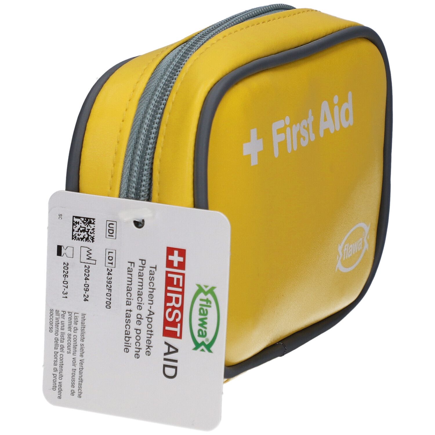 Trousse de premiers secours jaune avec fermeture éclair et bord gris. Étiquette avec texte. Inscription "First Aid" et logo "flawa".
