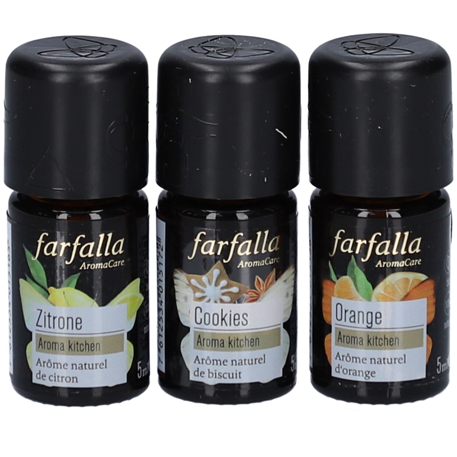 Drie kleine flesjes met zwarte doppen. Opschrift: farfalla AromaCare, Citroen, Cookies, Sinaasappel. 5ml.