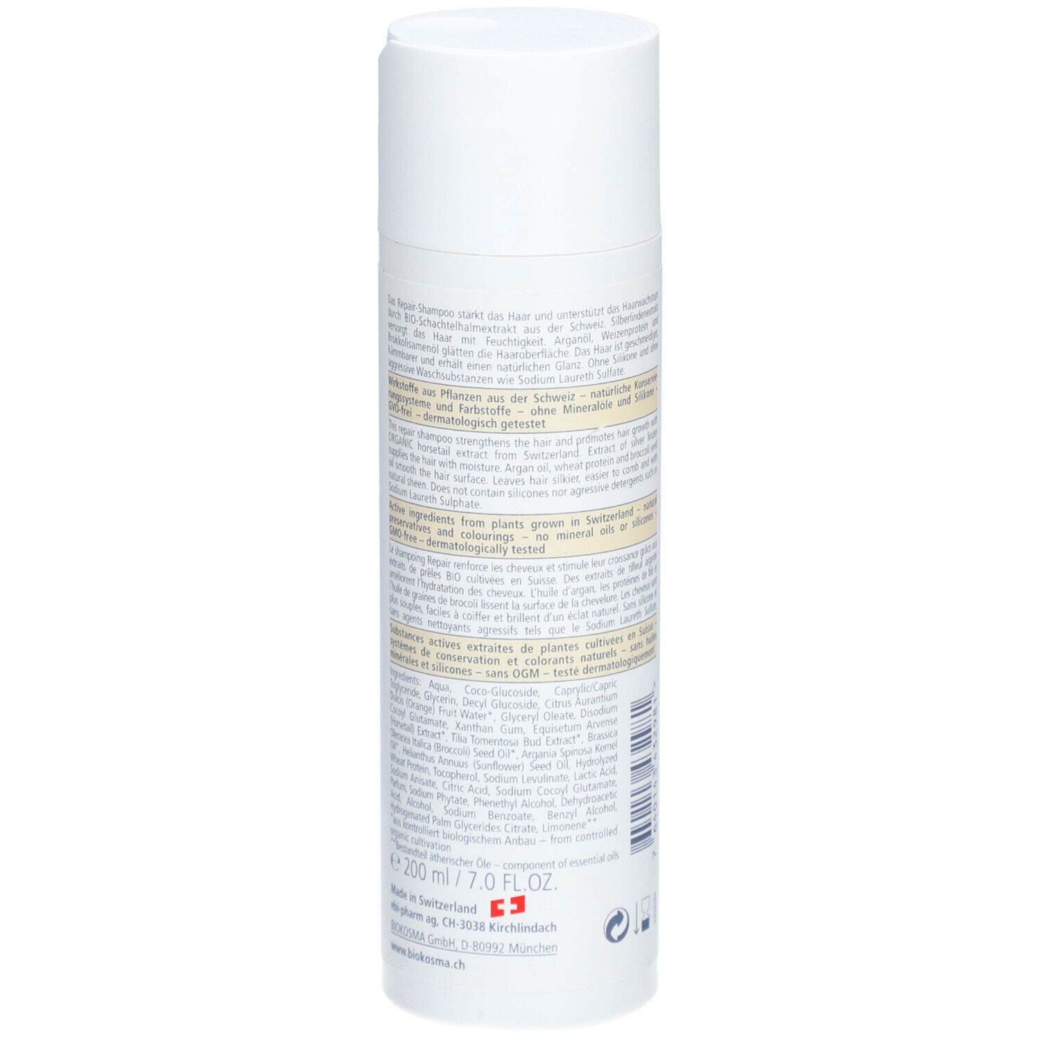 Dos du flacon de shampooing avec texte. Ingrédients, fabricant, volume. Label vegan.