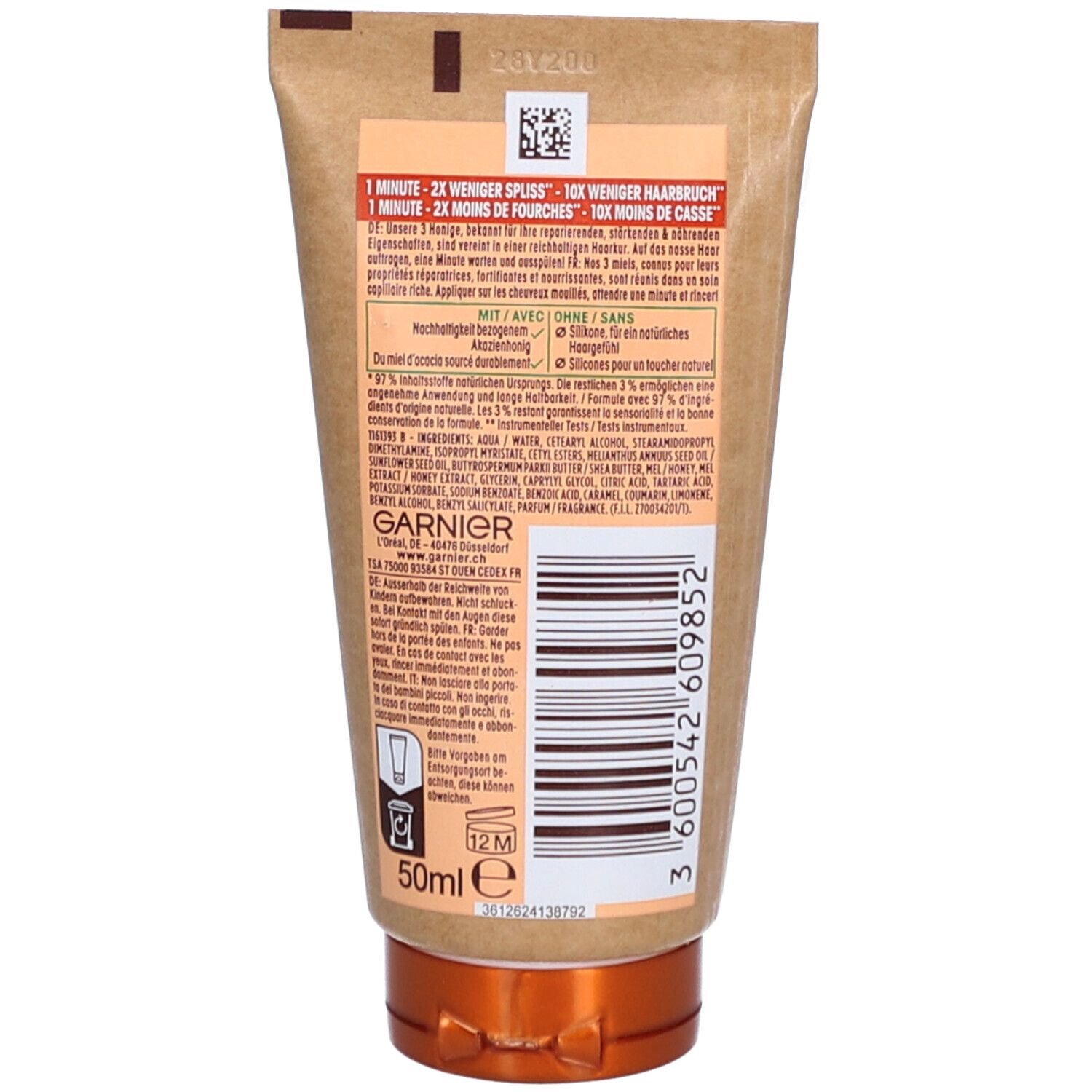 Dos du tube Garnier Ultra Doux Hair Remedy. Informations textuelles, ingrédients, logo et code-barres. Volume de 50 ml.