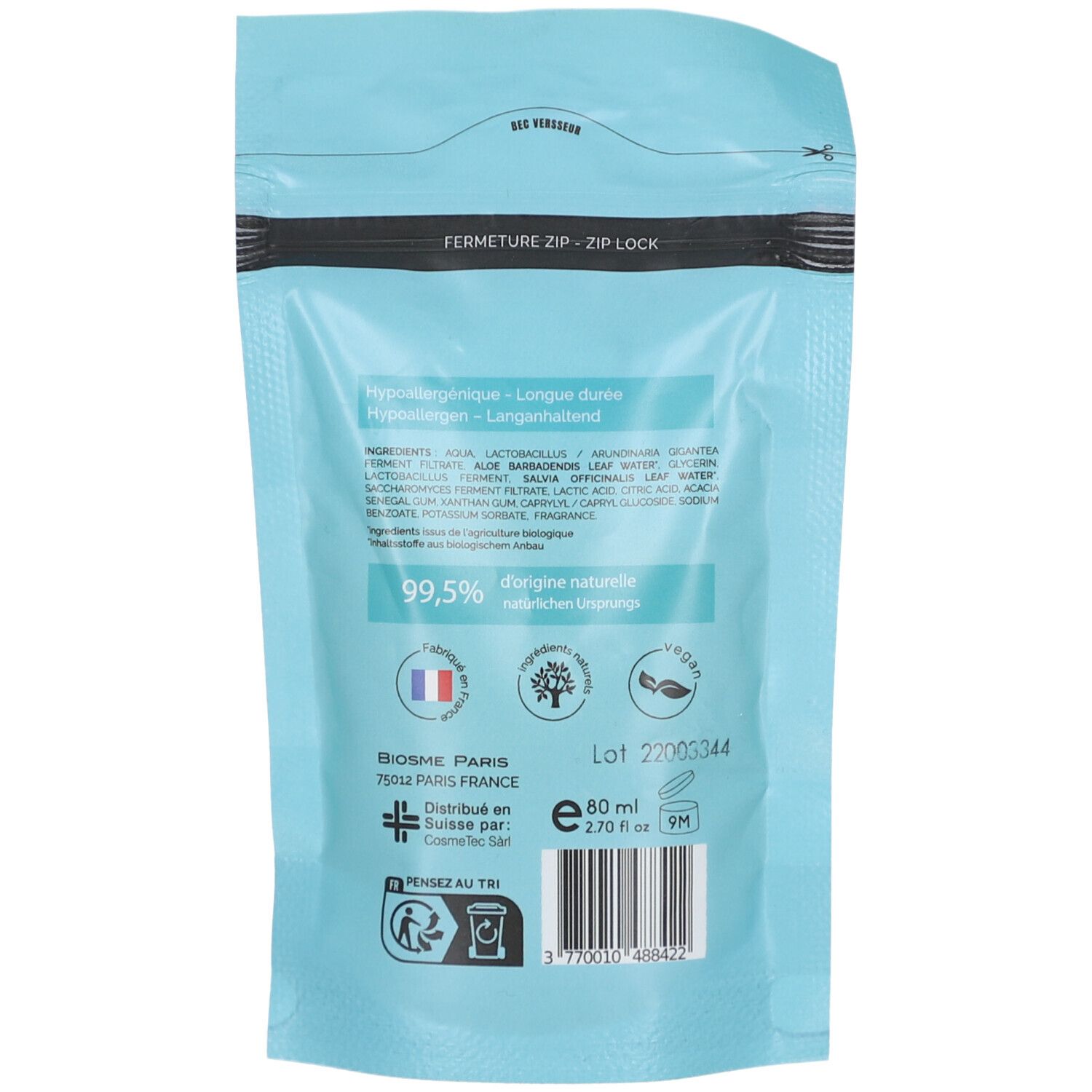 Dos de la recharge de déodorant. Fond bleu clair. Texte: ingrédients, 99,5% d'origine naturelle, Vegan.