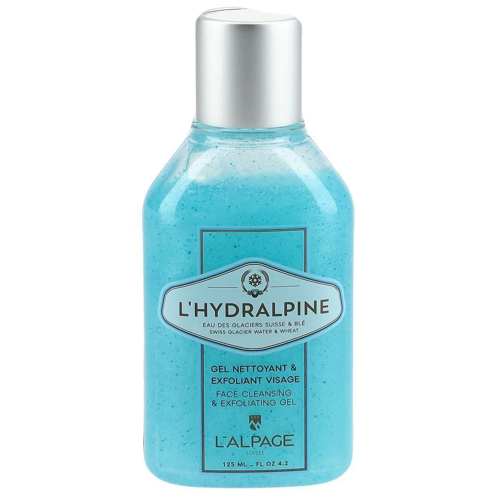 Blauwe gel in een fles met zilveren dop. Opschrift: L'Hydralpine, Gel Nettoyant & Exfoliant Visage, Face Cleansing & Exfoliating Gel.