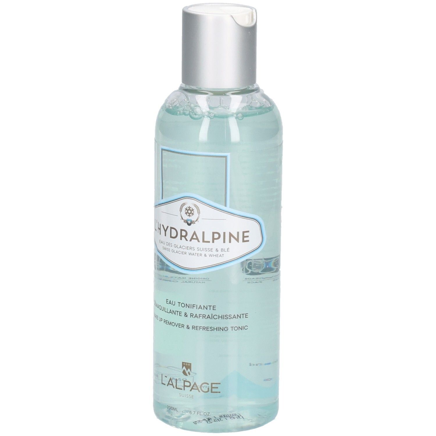 Transparante fles met zilveren dop. Etiket met productnaam L'Hydralpine en tekst. Blauwe vloeistof zichtbaar.