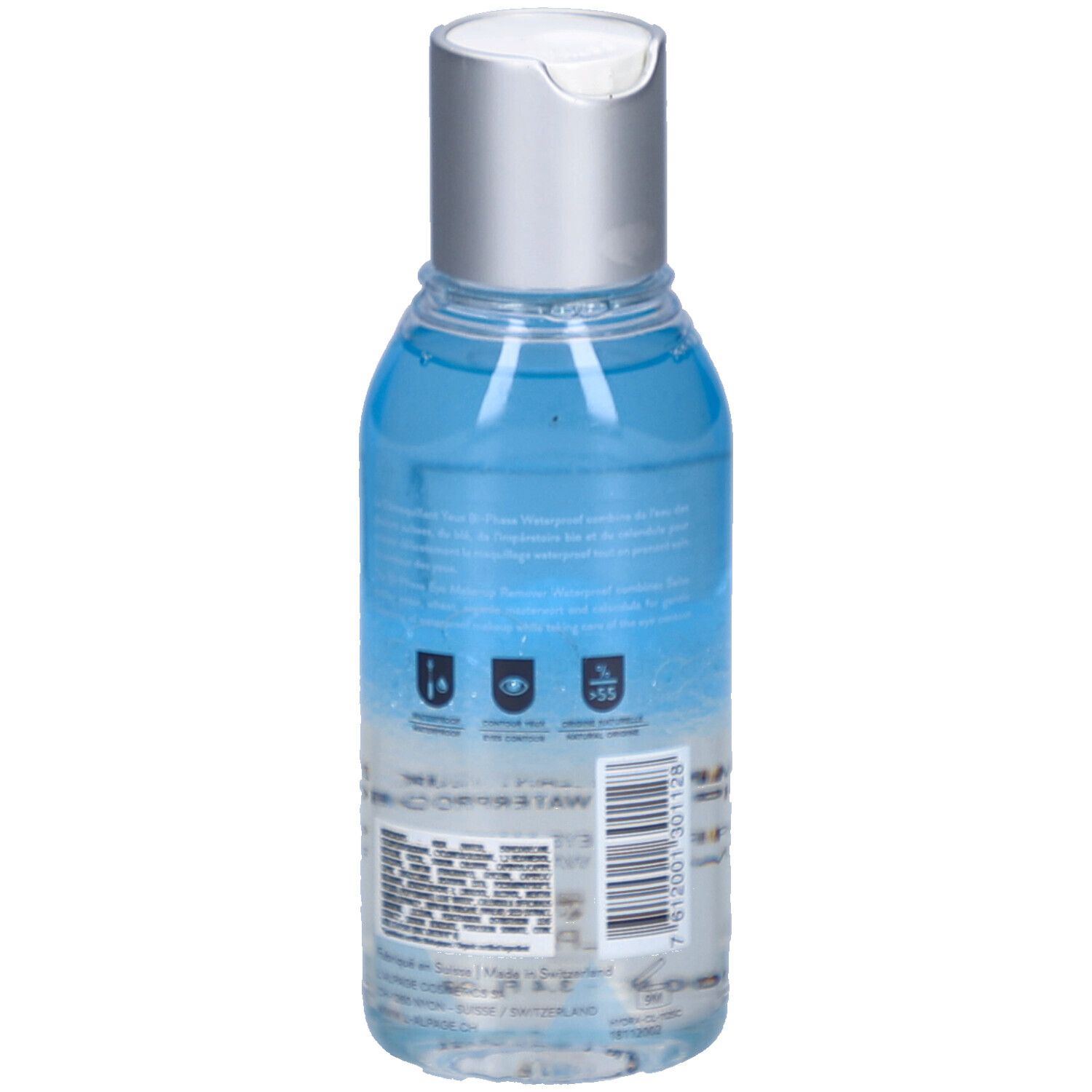 Achteraanzicht van de fles met blauwe en heldere inhoud. Zilveren dop. Tekst en symbolen op het etiket.