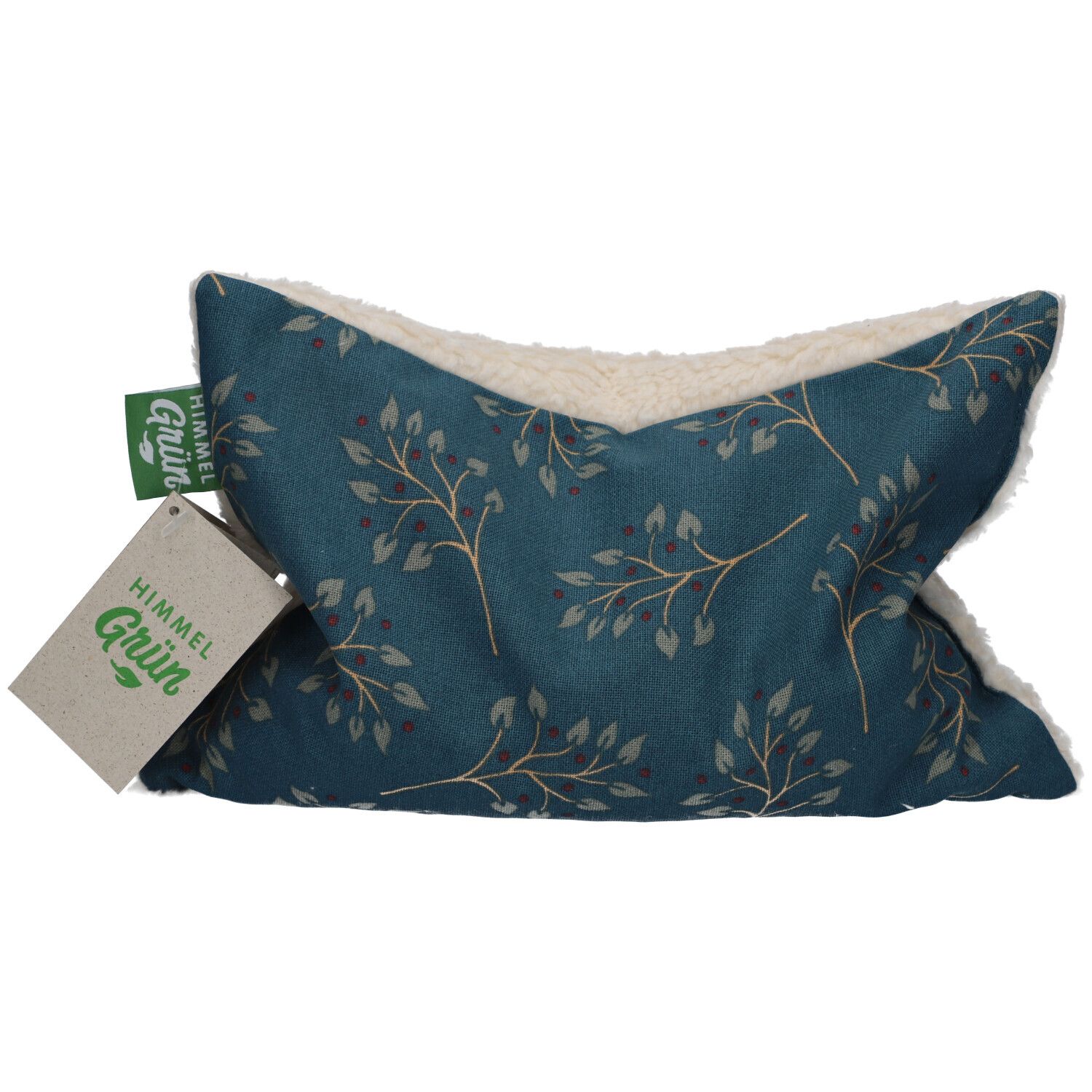 Kussen met blauwe stof, bloemenpatroon en crèmekleurige vacht. Label met "HIMMELGRÜN"-logo.