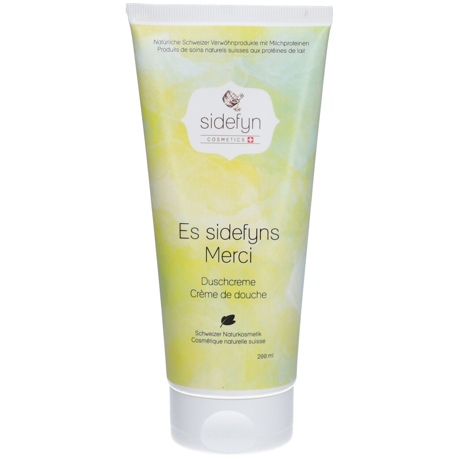 Tube Sidefyn douchecrème. Witte dop, geelgroene achtergrond. Opschrift: Es sidefyns Merci, douchecrème, Zwitserse natuurlijke cosmetica.