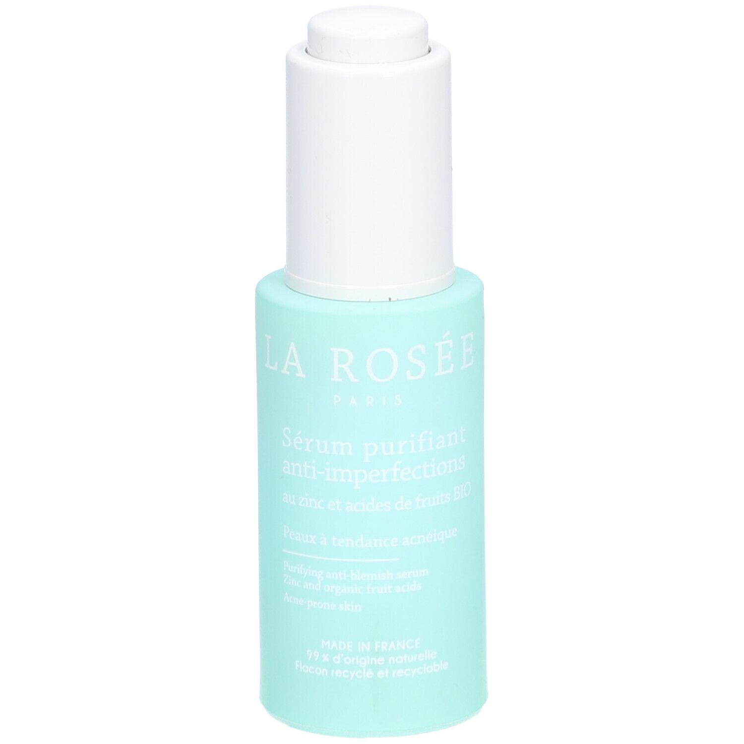 Flacon turquoise avec pompe blanche. Inscription: La Rosée Paris, Sérum purifiant anti-imperfections. Texte en français.