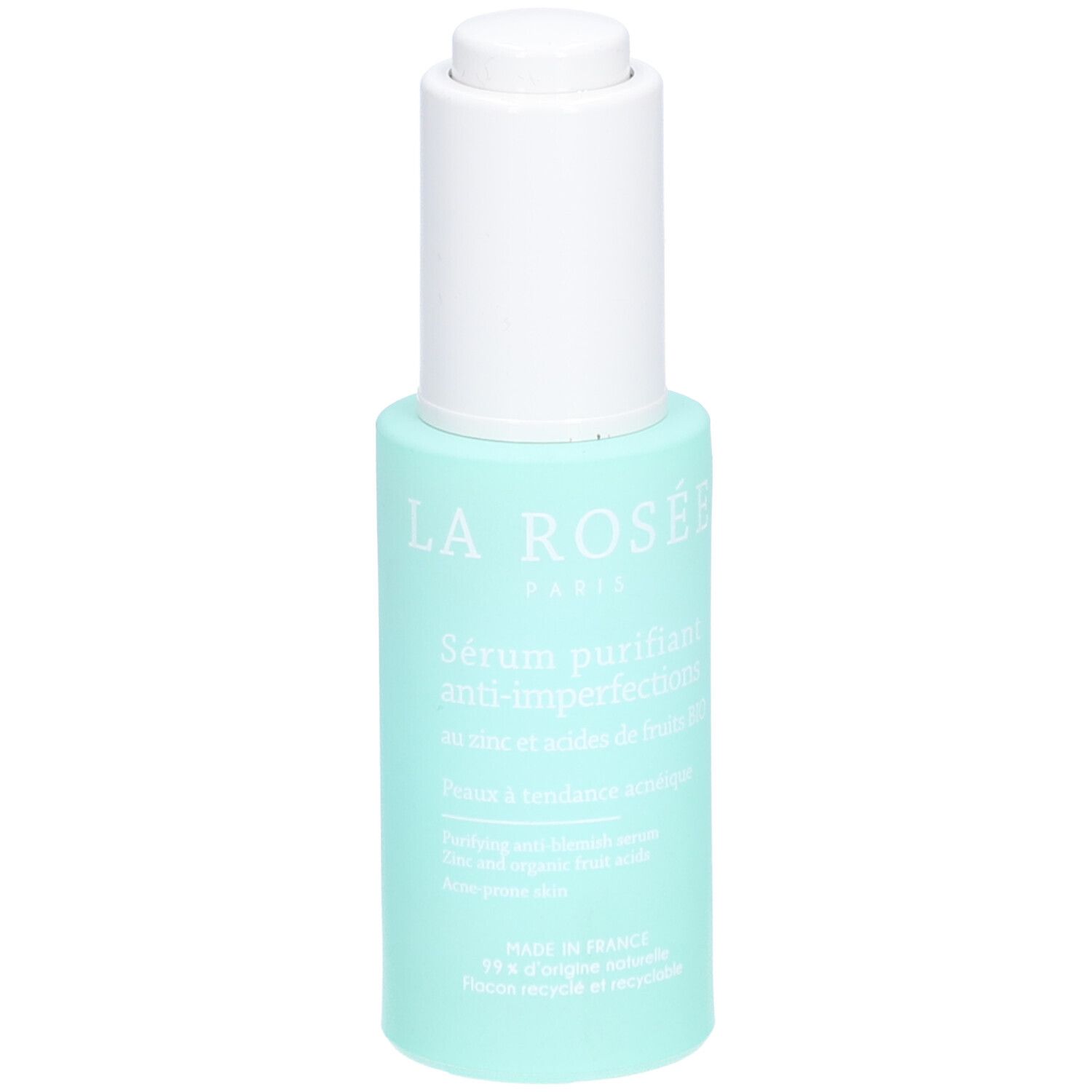 Flacon turquoise avec pompe blanche. Inscription: La Rosée Paris, Sérum purifiant anti-imperfections. Texte en français.