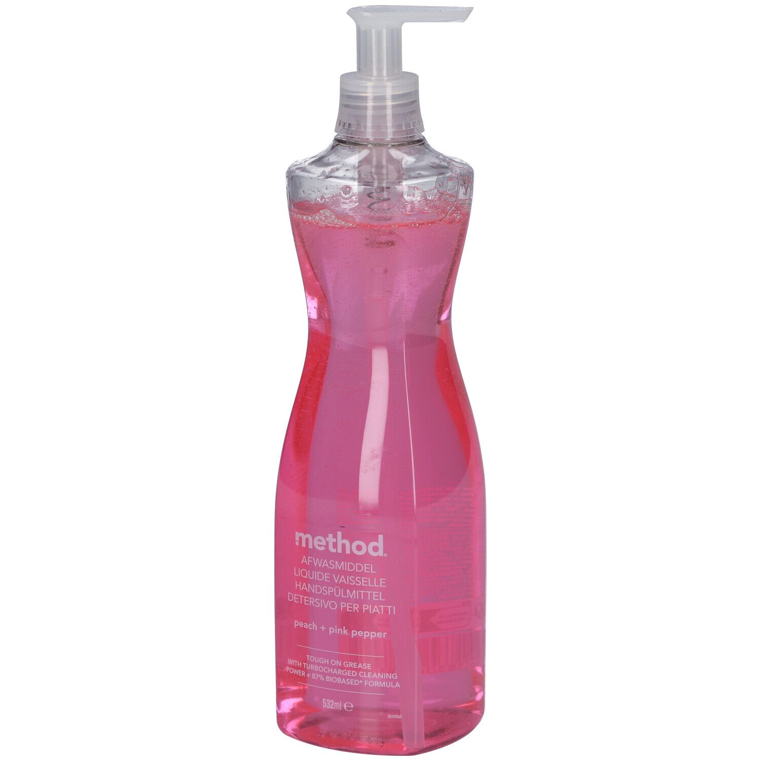 Fles roze afwasmiddel, transparante dispenser. Opschrift: method, Peach + Pink Pepper.