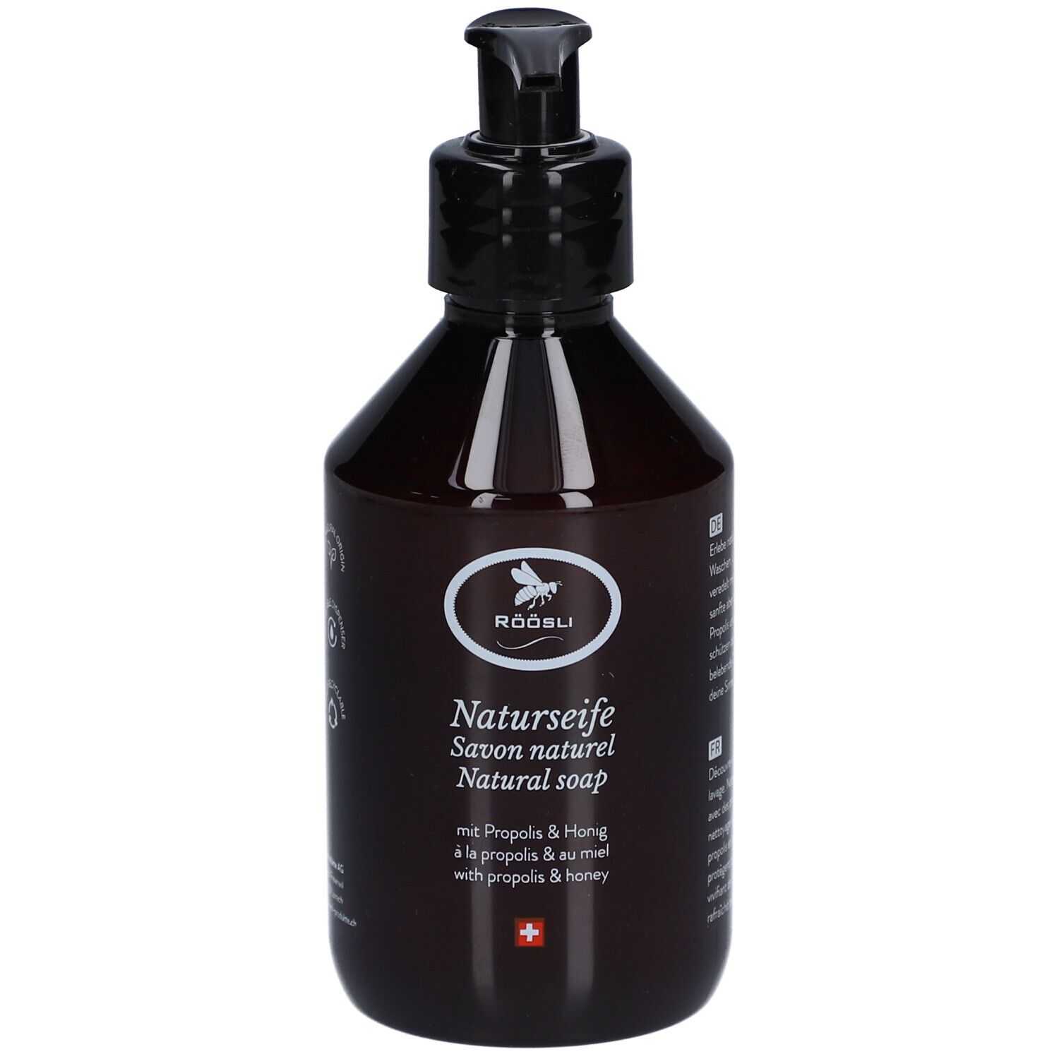 Bruine fles met zwarte pomp. Etiket met logo, tekst Natuurzeep, Propolis & Honing, Zwitsers kruis.