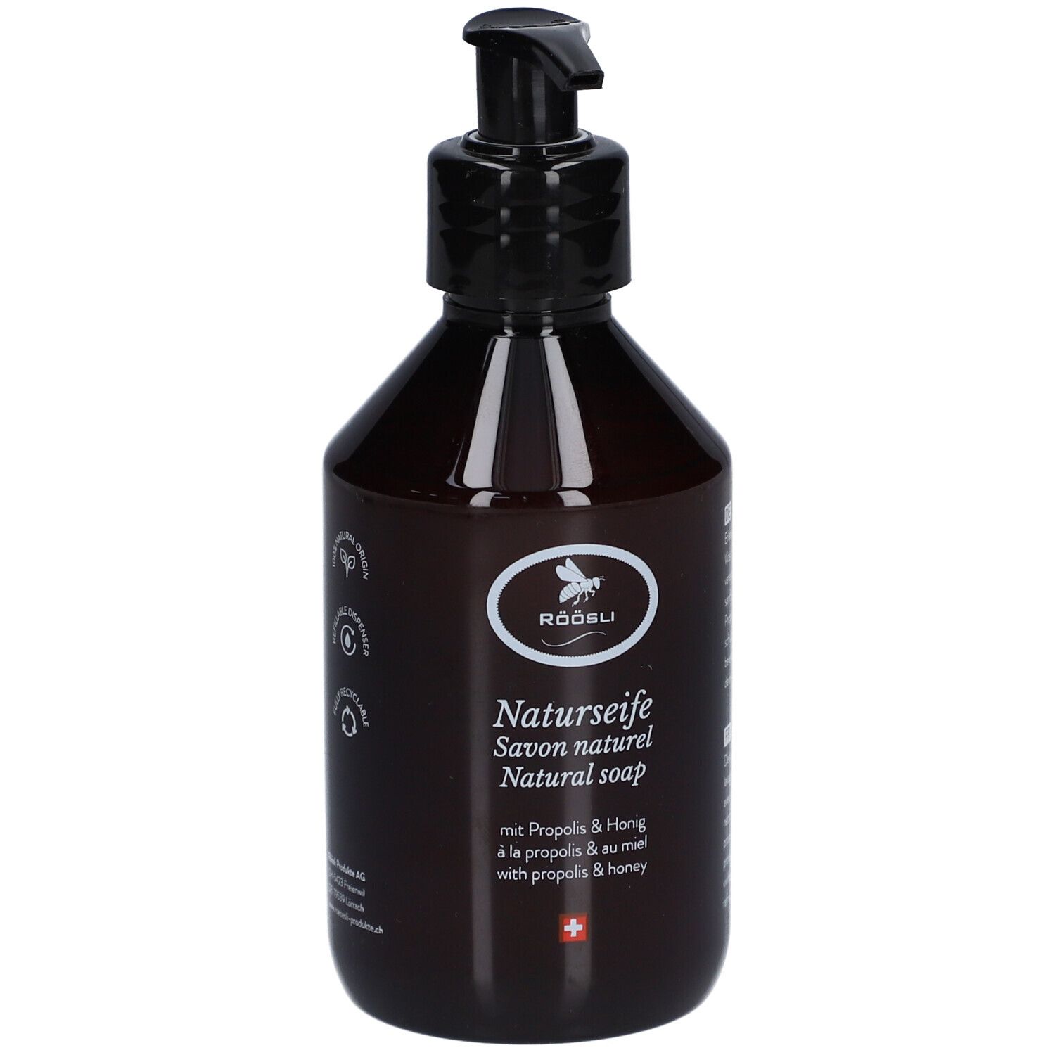 Bruine fles met zwarte pomp. Etiket met logo, tekst Natuurzeep, Propolis & Honing, Zwitsers kruis.