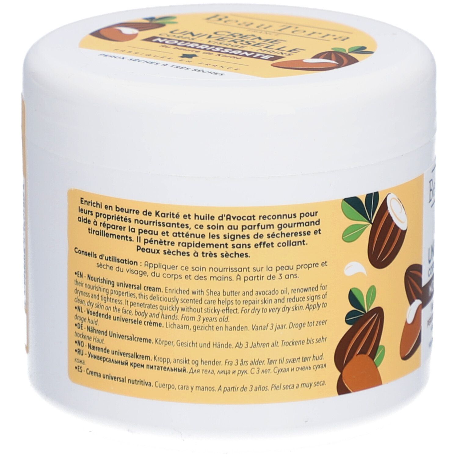 Achterkant van de witte pot. Tekst in meerdere talen. Bevat shea butter en avocado-olie. Voor droge tot zeer droge huid.