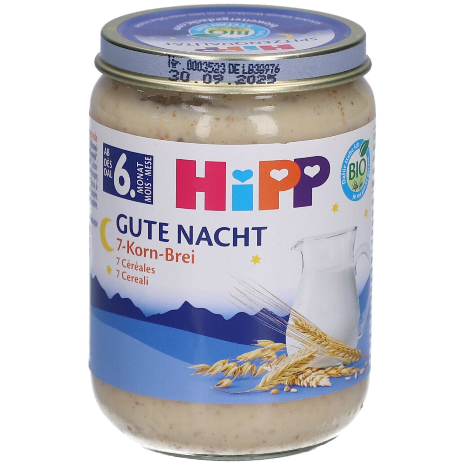 Pot de purée pour bébé. Inscription: HIPP Gute Nacht 7-Korn-Brei. Dès 6 mois. Avec pichet de lait et épi de blé.