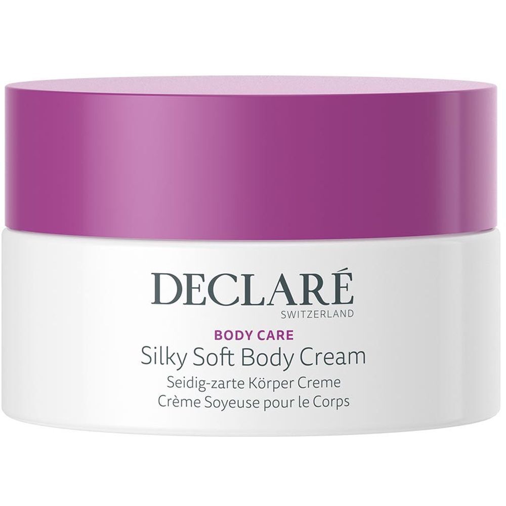 Witte pot met paarse deksel. Opschrift: DECLARÉ SWITZERLAND, BODY CARE, Silky Soft Body Cream. Meertalige productnamen.