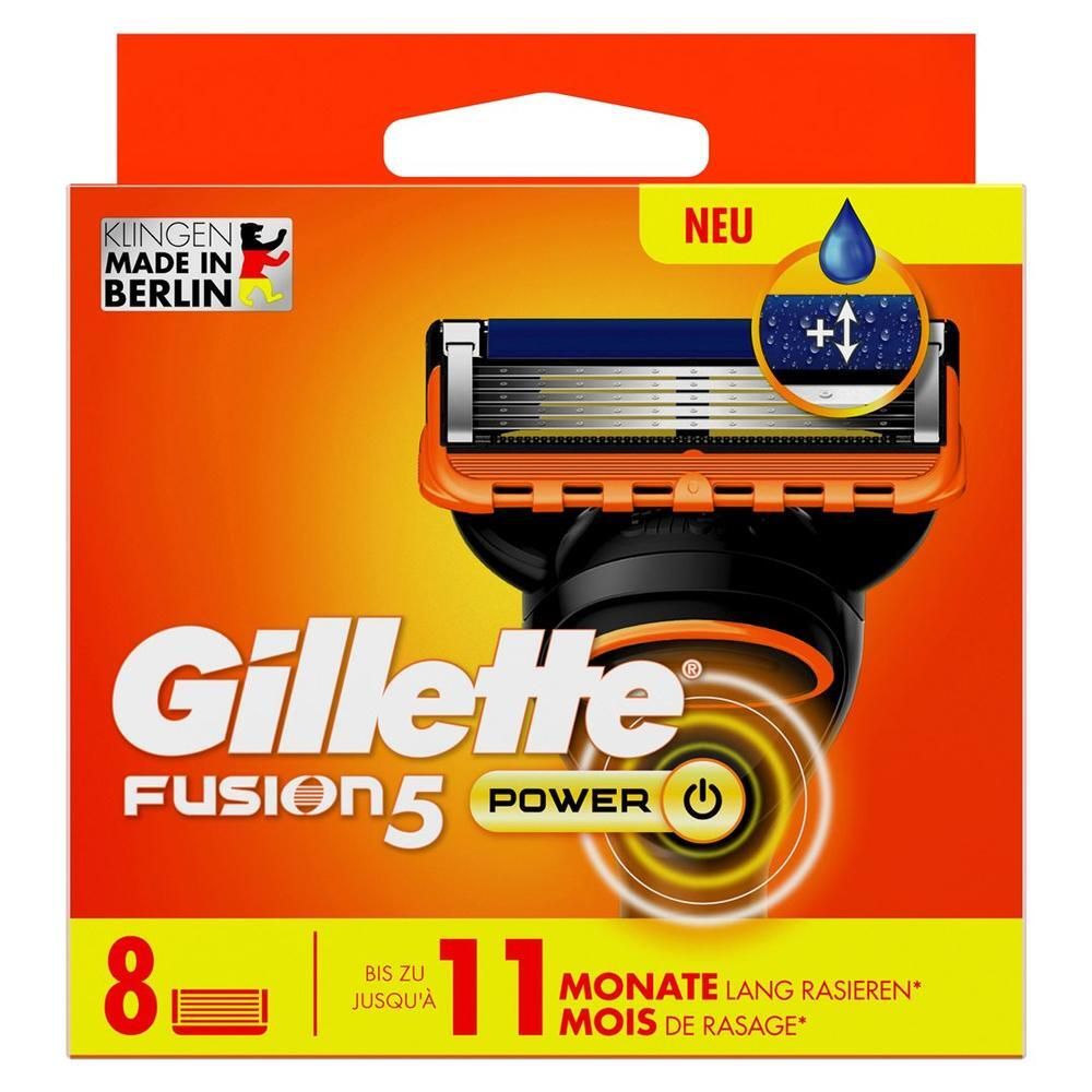 Verpakking met Gillette Fusion5 Power scheermesjes. Oranje doos met productafbeelding en tekst. 8 mesjes, 11 maanden scheren.