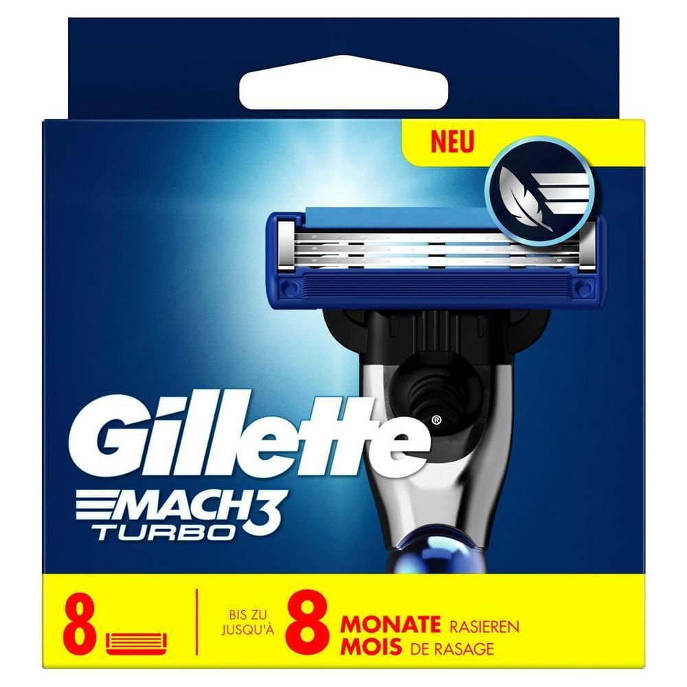 Verpakking met scheermesjes. Bevat 8 mesjes. Merk: Gillette Mach3 Turbo. Blauwe en gele verpakking met afbeelding van scheermes.