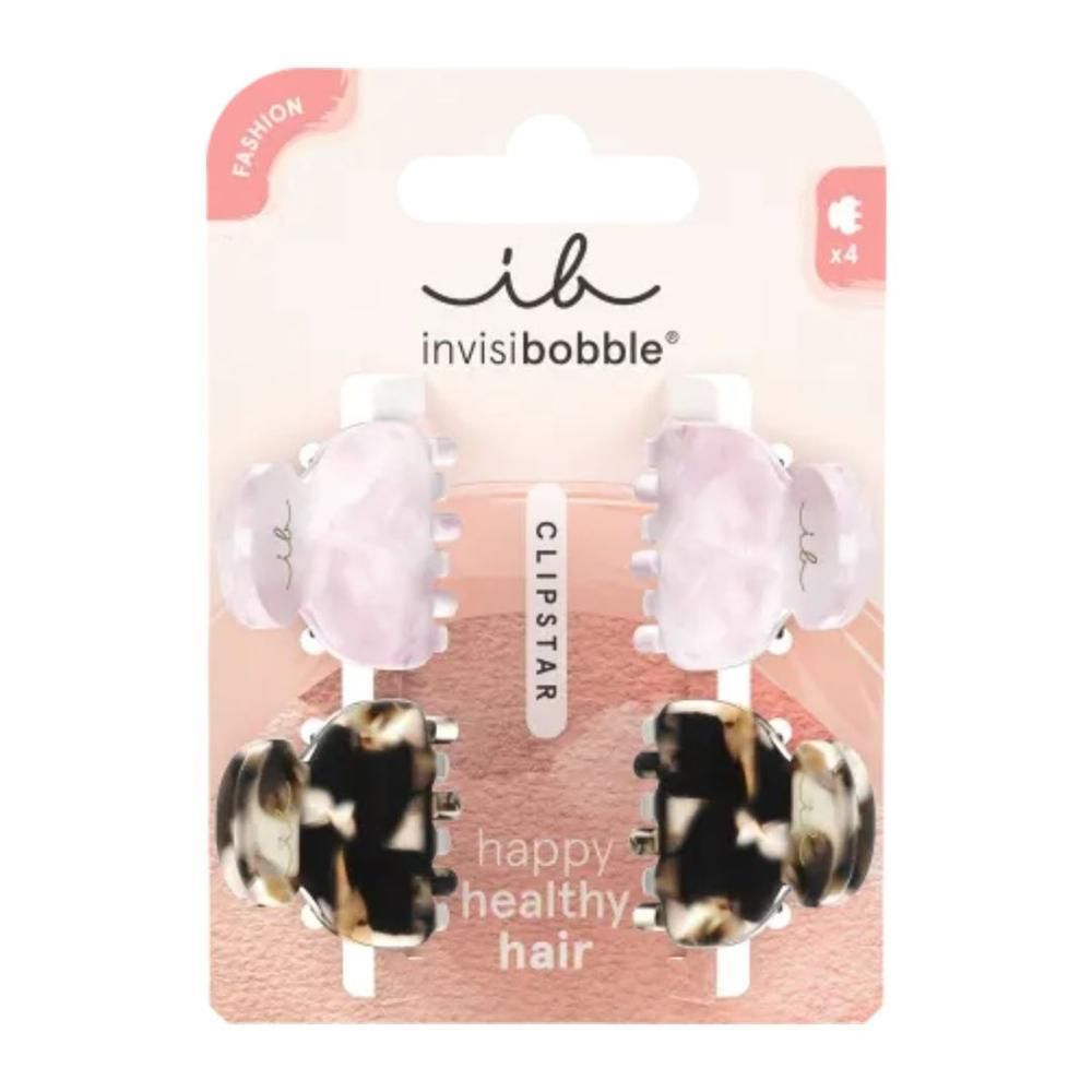Emballage de quatre pinces à cheveux. Deux roses claires et deux marron et noires. Marque : invisibobble. Inscription : CLIPSTAR.
