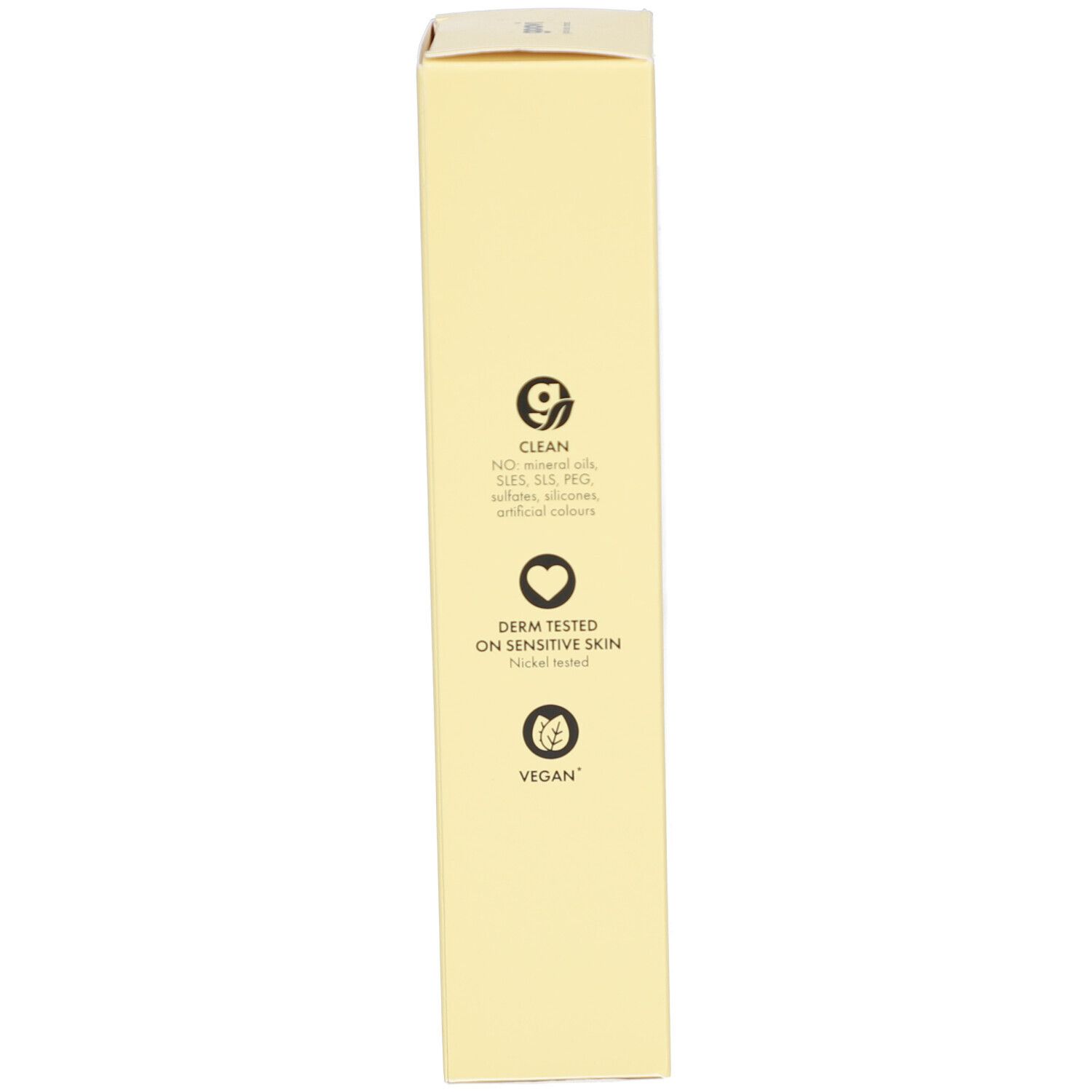 Boîte jaune avec logos. Contient les logos « Clean », « Testé dermatologiquement » et « Vegan ».