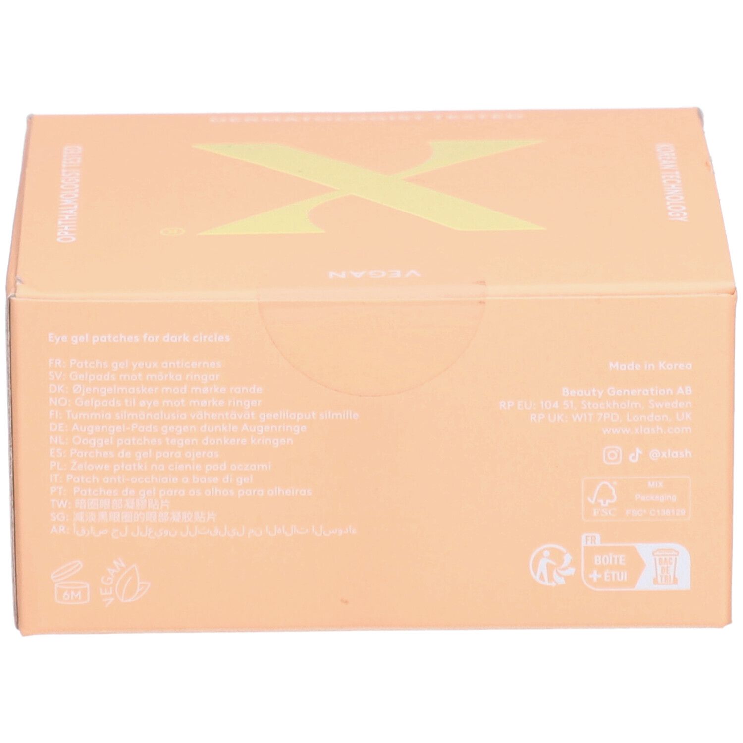 Boîte en carton beige. Texte multilingue. Logo végan.