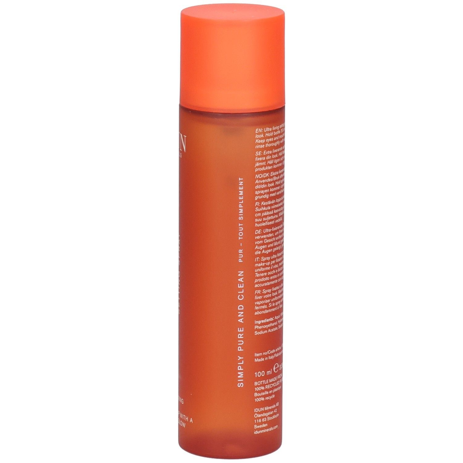 Achterkant van de oranje spuitfles. Tekst in meerdere talen. 100 ml. Recycling logo. Veganistisch logo.