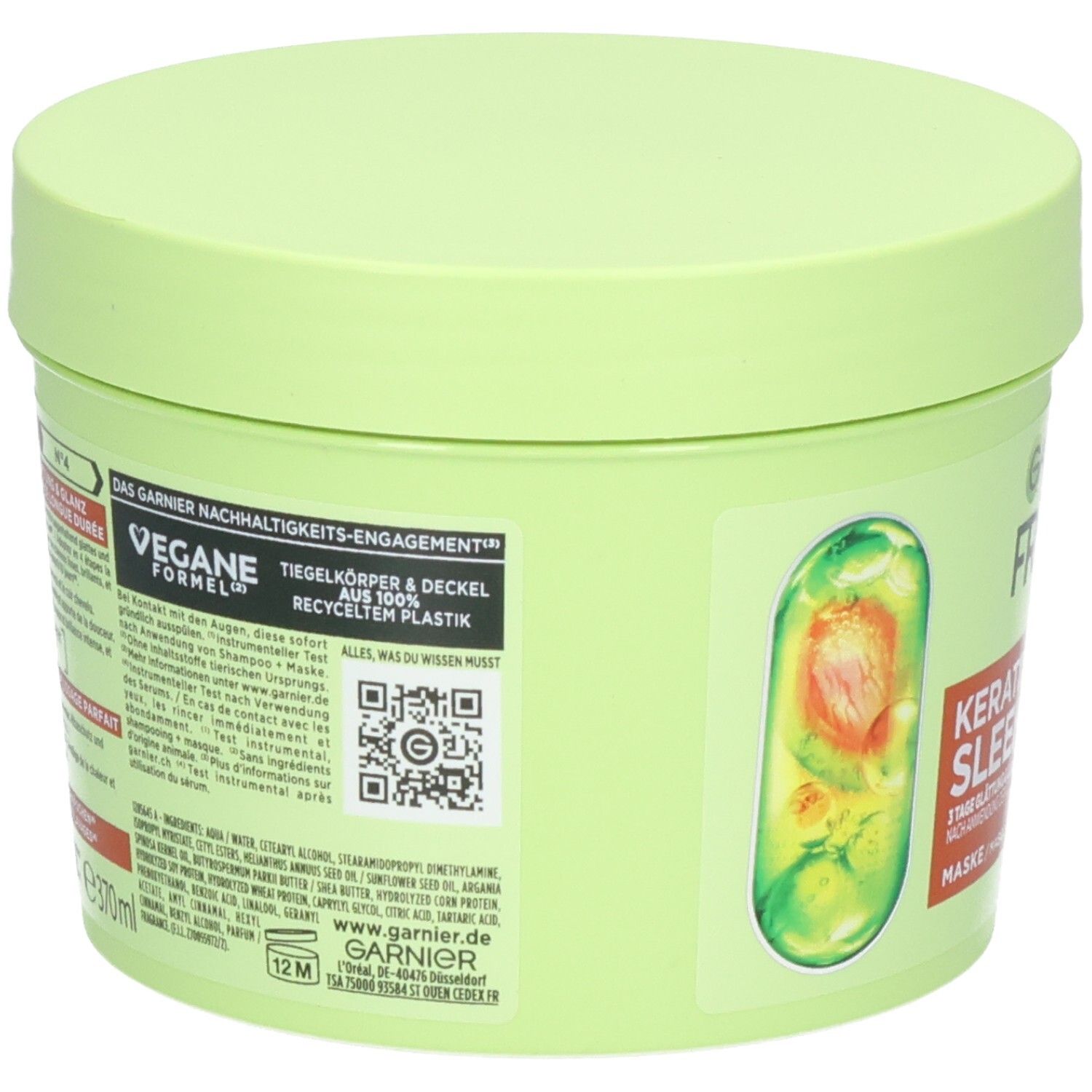 Lichtgroene pot met Garnier Fructis haarmasker, keratine formule, 3-minuten intensieve verzorging. Avocado-illustratie.