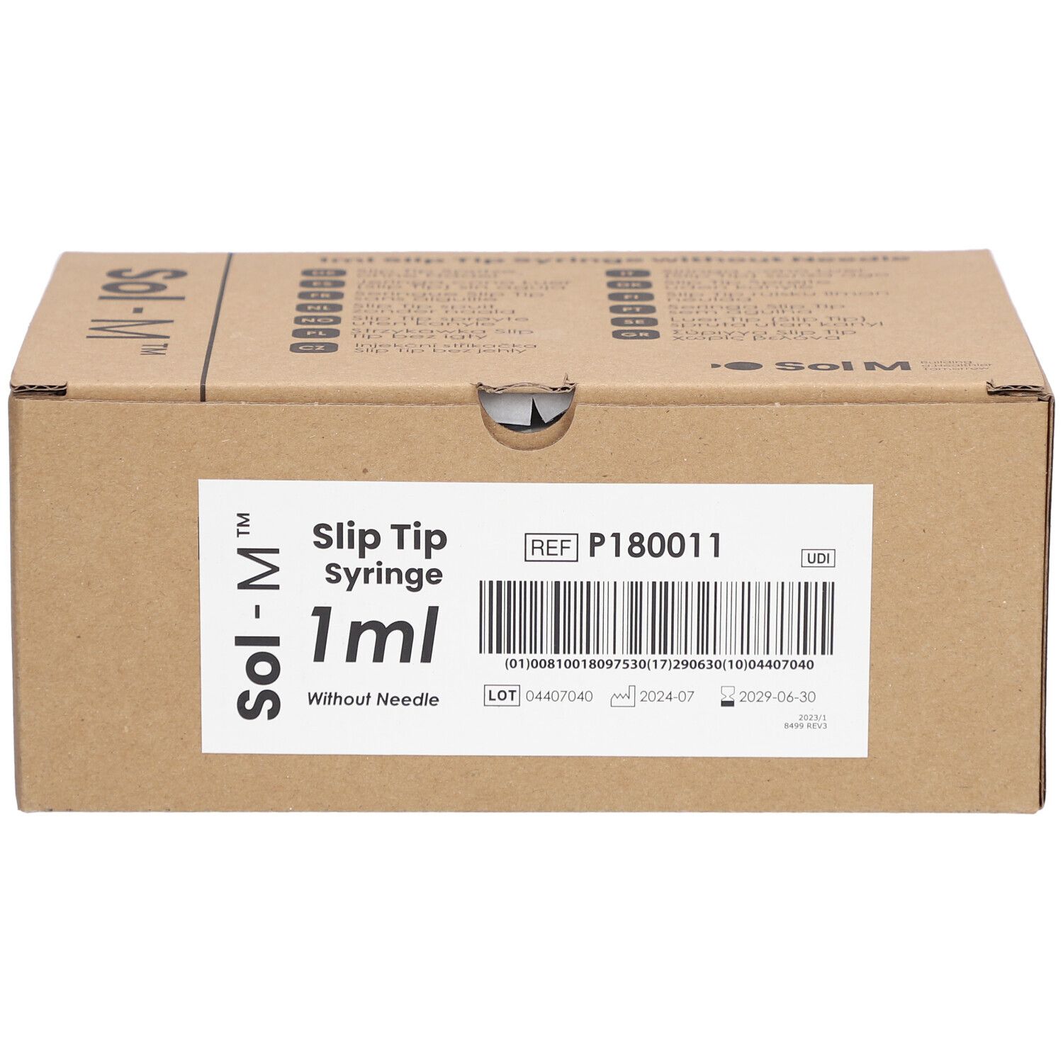 Emballage en carton pour seringues Sol-M. Inscription: Slip Tip Syringe 1ml sans aiguille. Informations produit et code-barres.