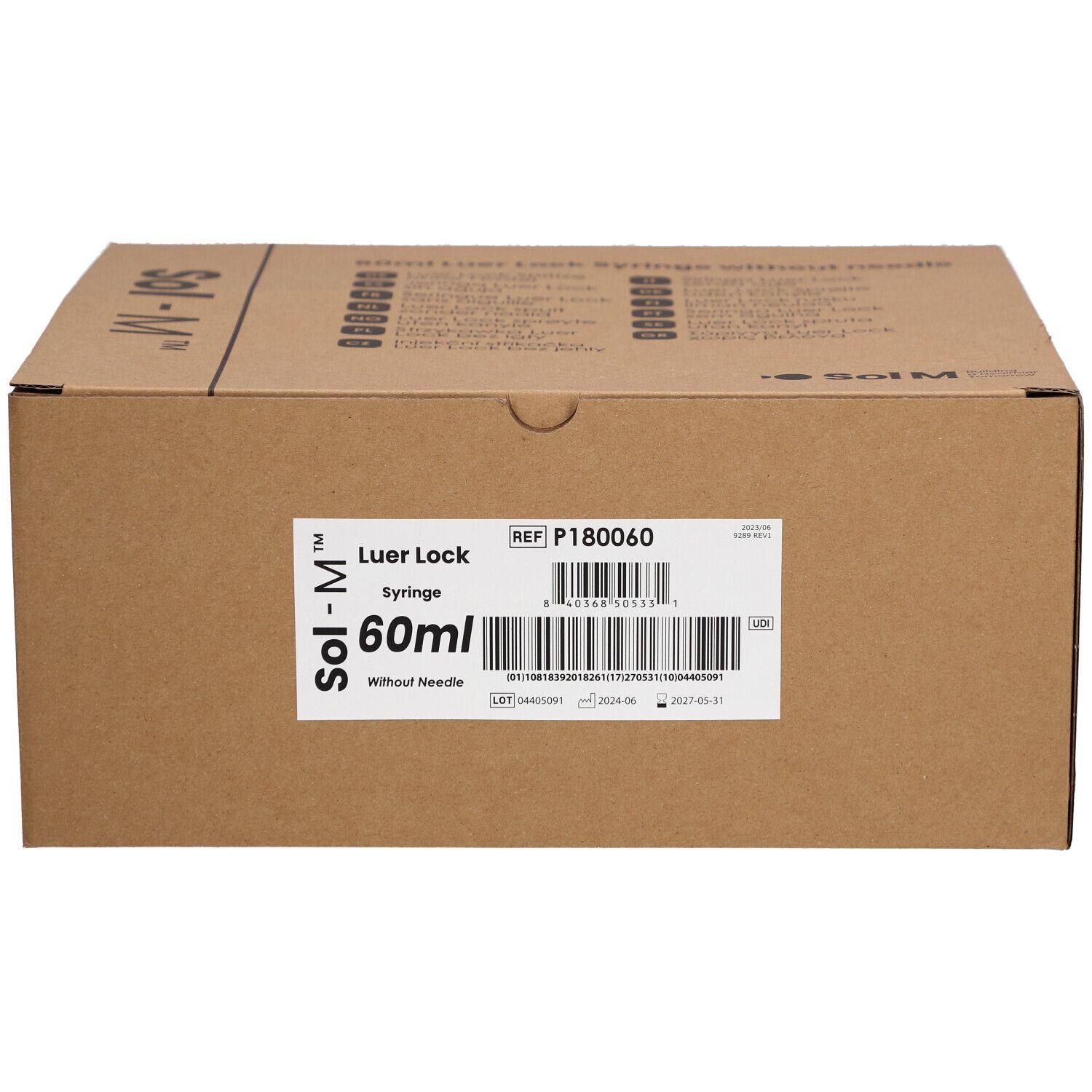 Kartonnen verpakking met productinformatie. Opschrift: Sol-M, Luer Lock, 60ml, zonder naald. Barcode en referentienummer.