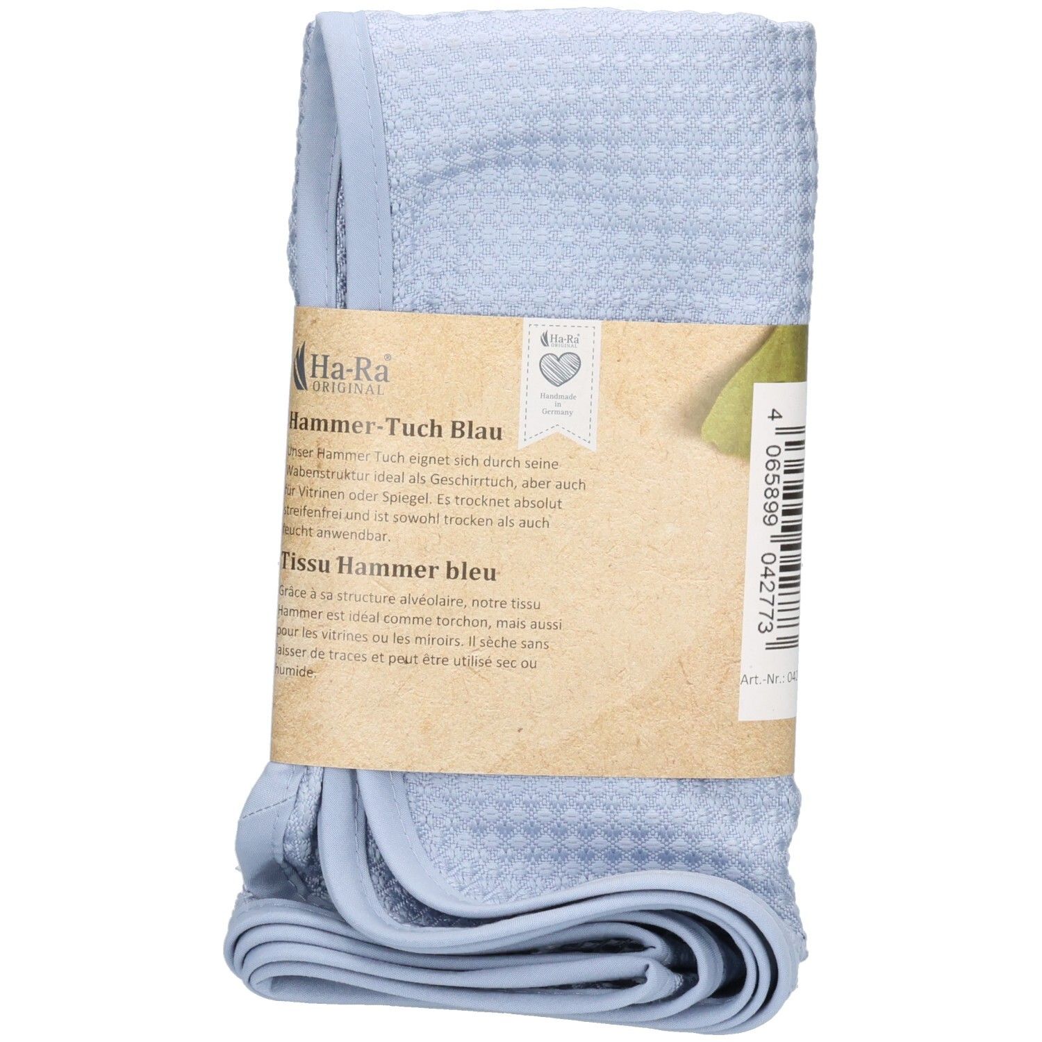 Blauwe Hammer-doek, opgevouwen en met papieren banderol. Opdruk: Ha-Ra Professional, productnaam, tekst en logo.