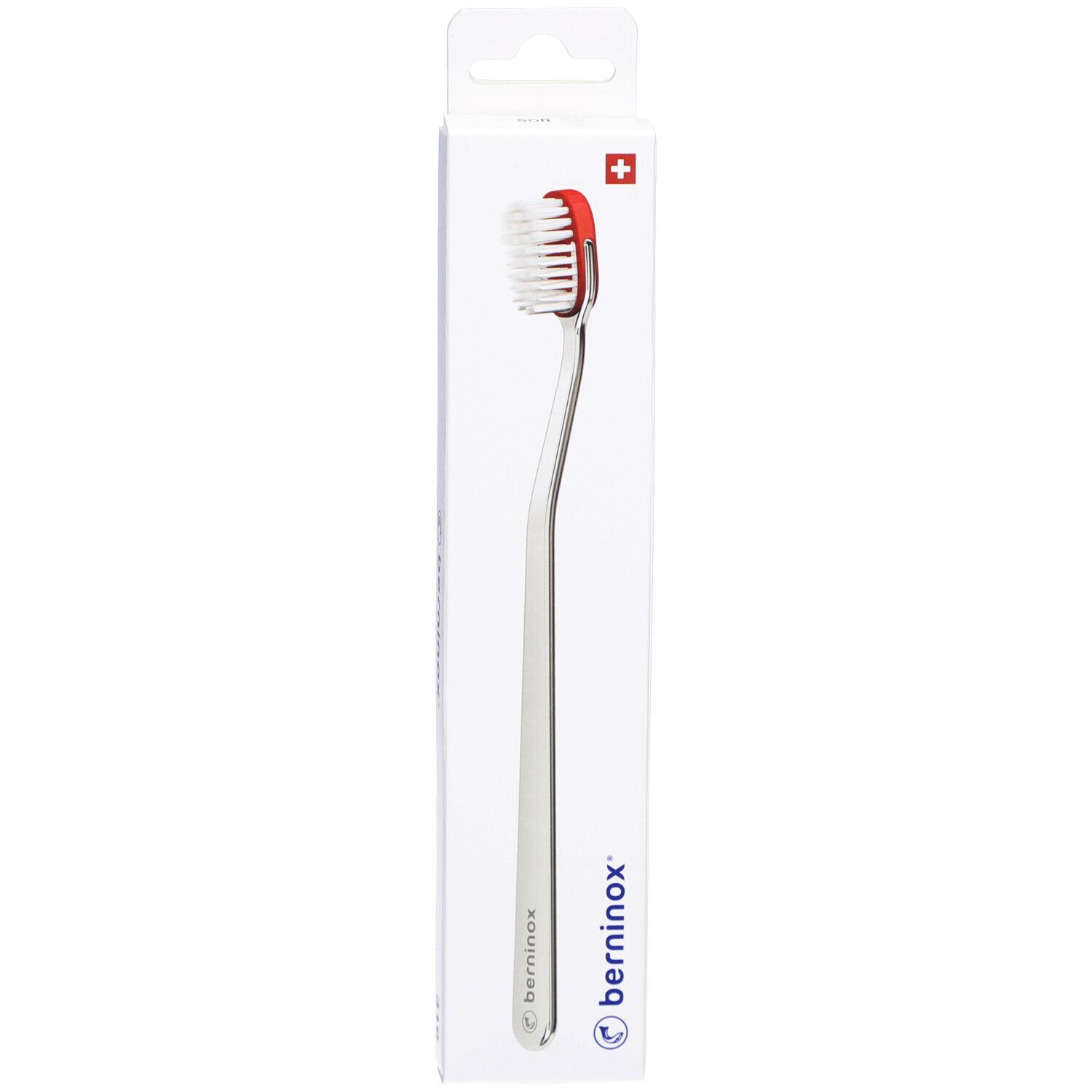 Brosse à dents Berninox 316, corail, Soft. Emballée. Croix suisse. Tête rouge, manche blanc.