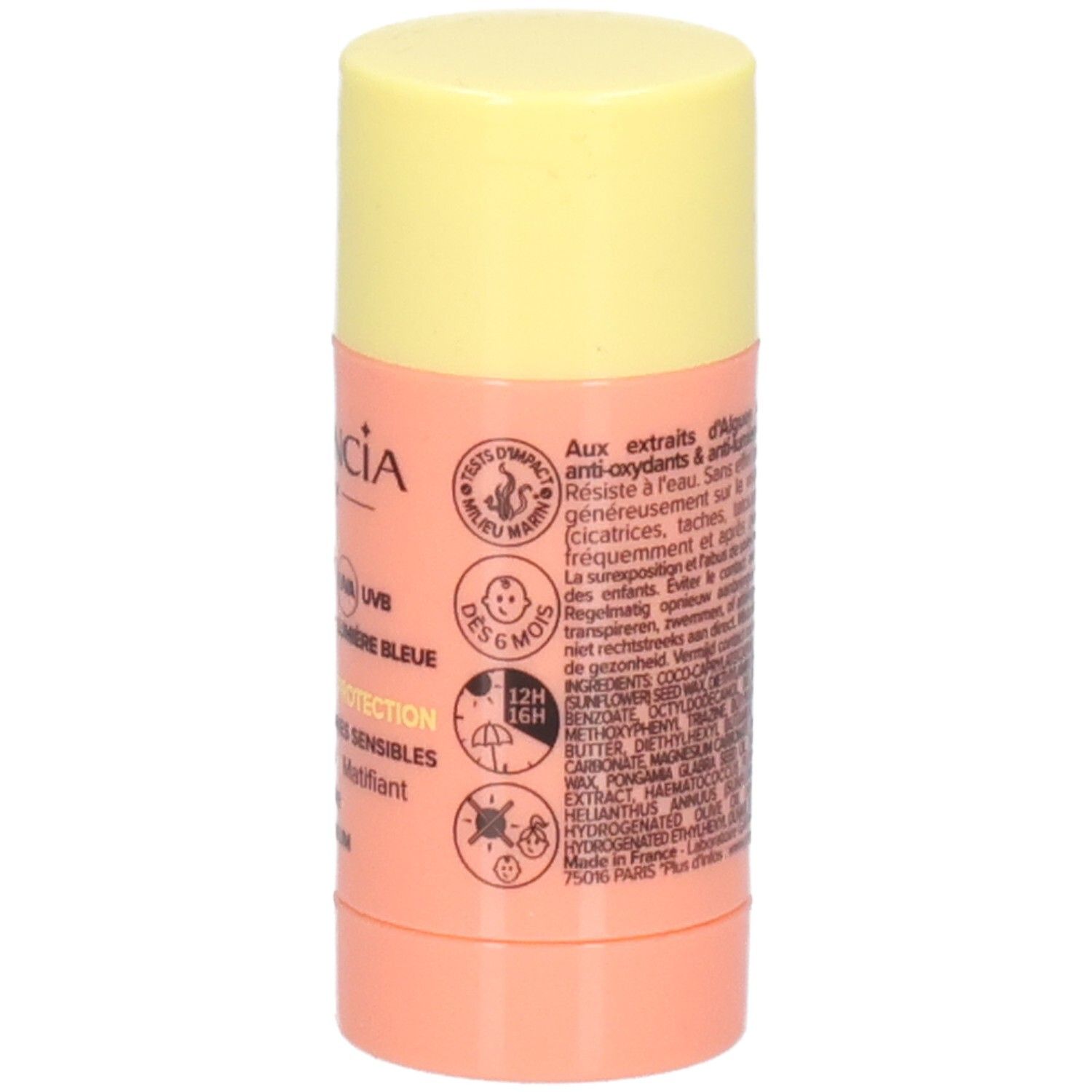 Zonnestick met gele dop en roze houder. Tekst: GARANCIA, SPF 50+, 12H 16H, DES 6 MOIS, waterbestendig.