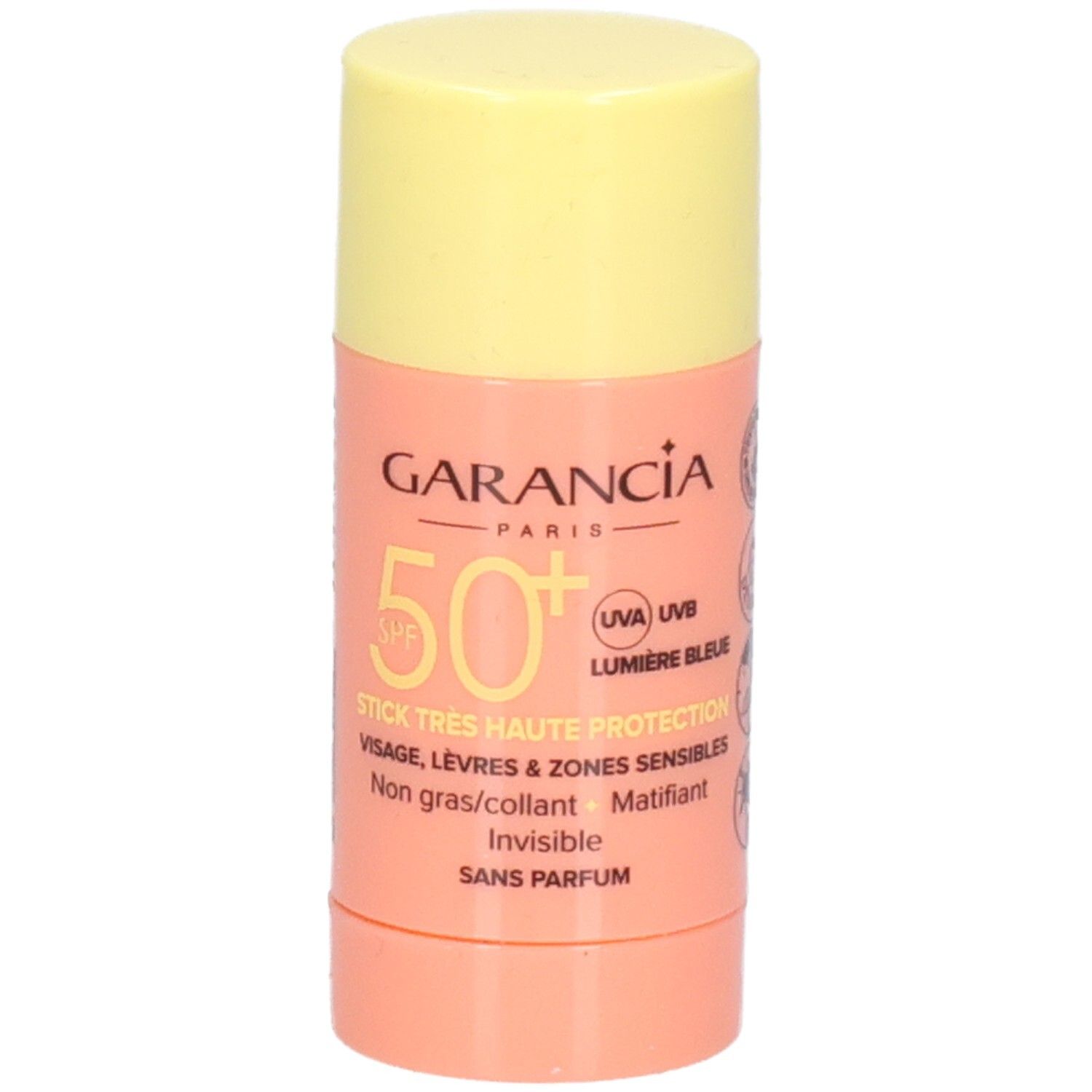 Zonnestick met gele dop en roze houder. Tekst: GARANCIA, SPF 50+, STICK TRES HAUTE PROTECTION, visage, lèvres.