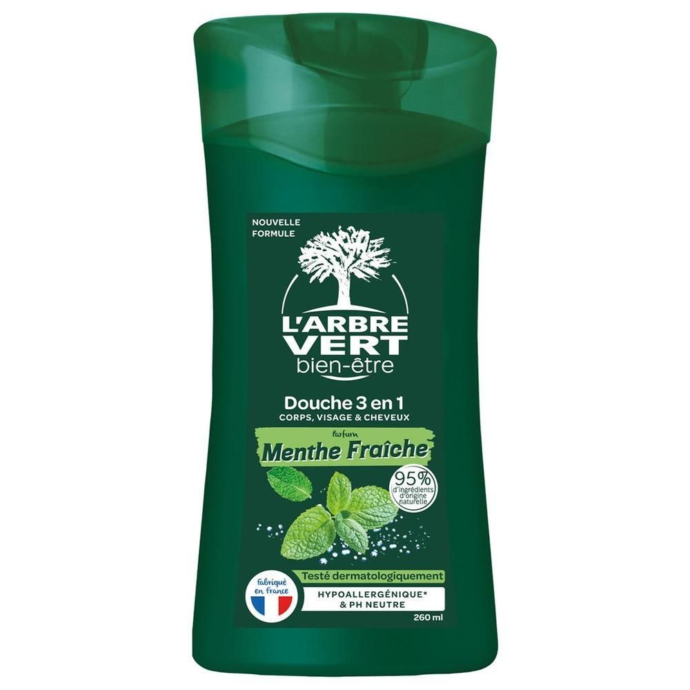 Flacon vert avec étiquette. Texte: L'ARBRE VERT, Douche 3 en 1, Menthe Fraîche. Illustration de feuilles de menthe.