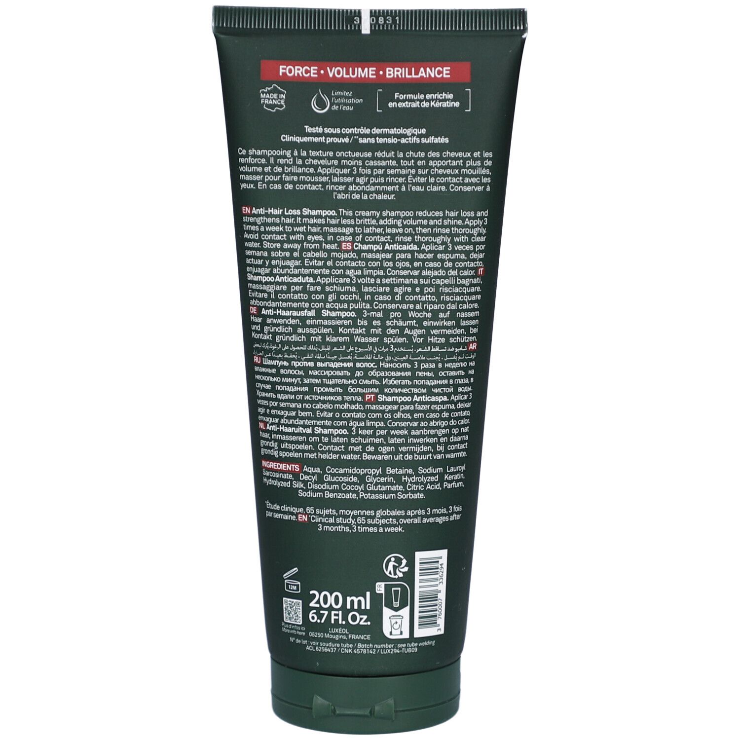 Achterkant van de shampoo tube. Meertalige tekst. 200 ml. 6.7 Fl.oz. Groene tube met zwarte dop.