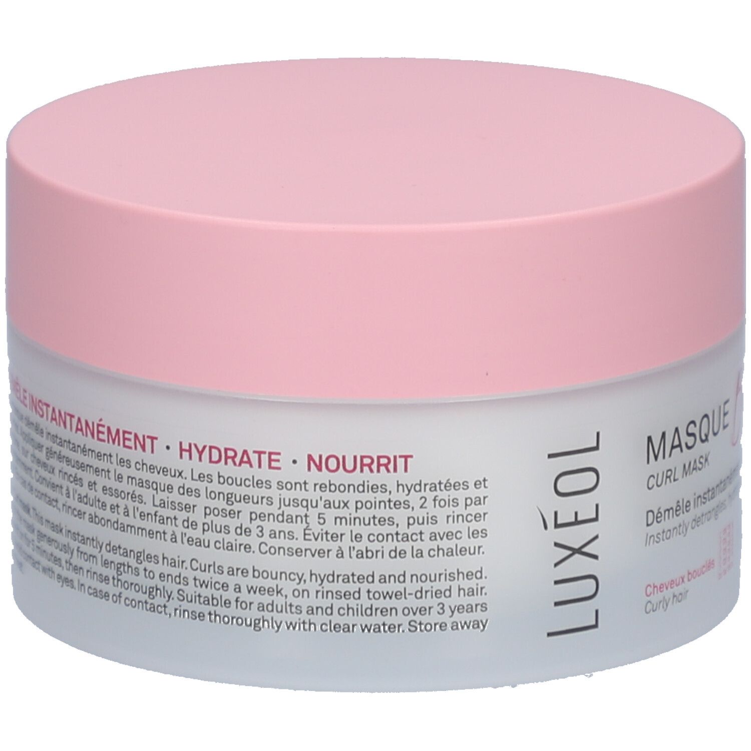 Ronde pot met roze deksel. Tekst: DÉMÊLE INSTANTANÉMENT - HYDRATE - NOURRIT. Voor krullend haar. Instructies in het Frans en Engels.