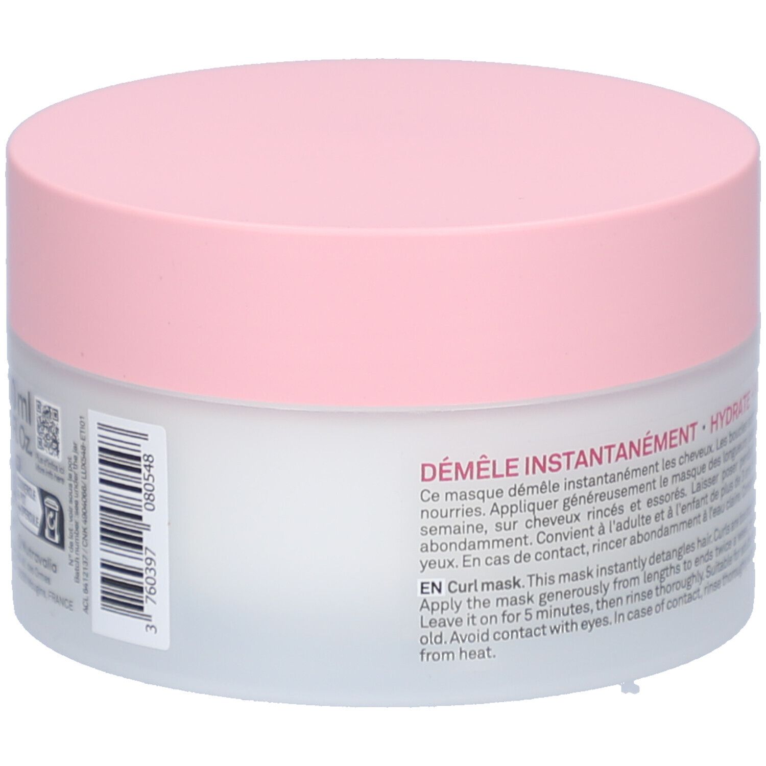 Ronde pot met roze deksel. Tekst: DÉMÊLE INSTANTANÉMENT - HYDRATE - NOURRIT. Voor krullend haar. Instructies in het Frans en Engels.