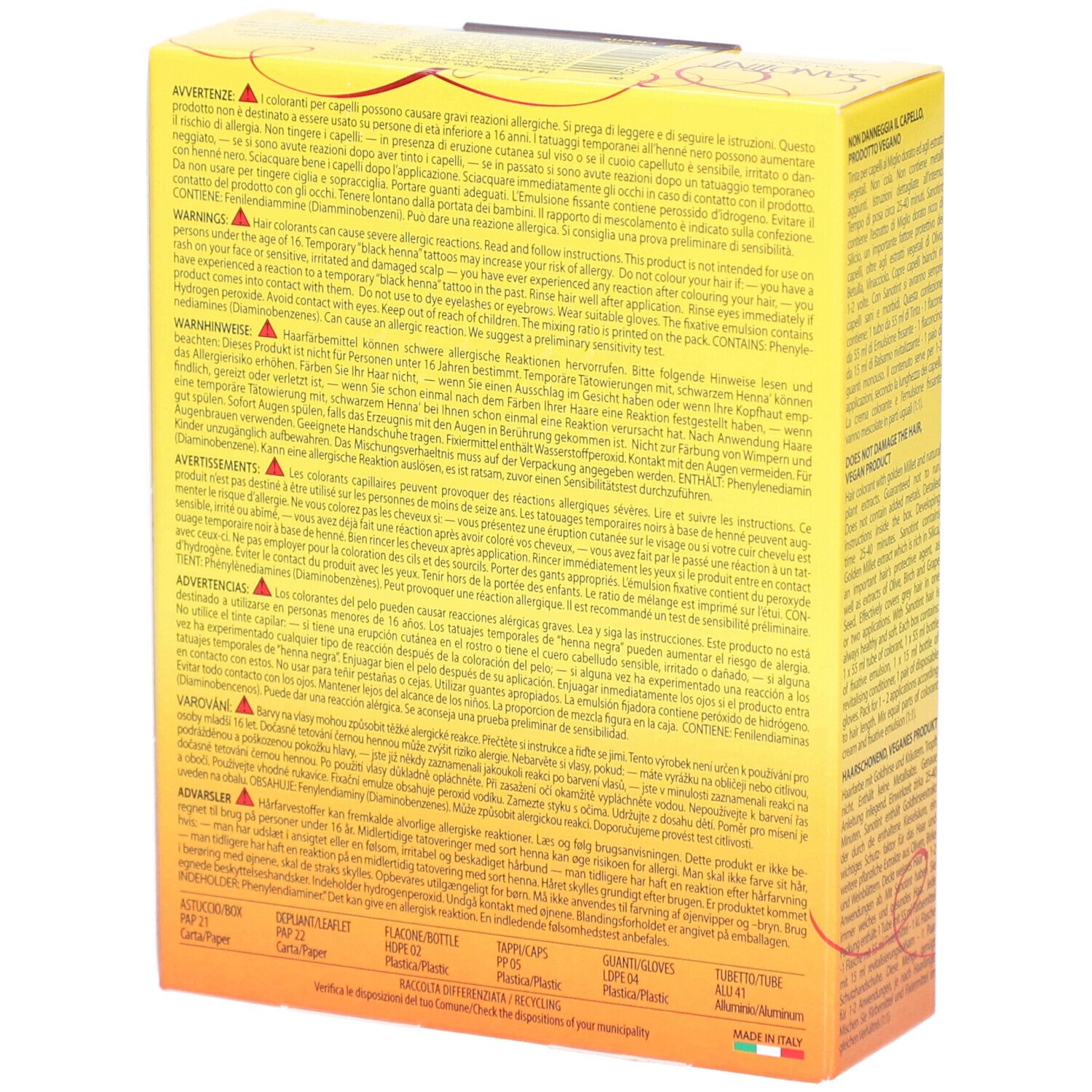 Boîte jaune avec texte multilingue. Avertissements et ingrédients. Inscription : Fabriqué en Italie.