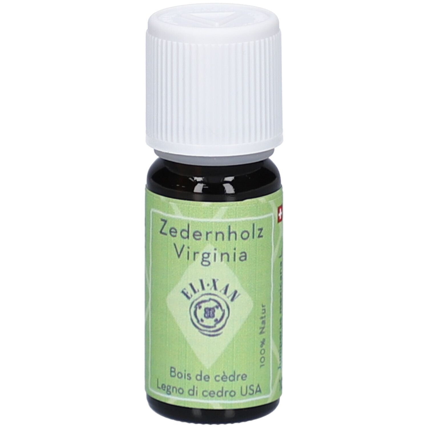 Donkerbruine glazen fles met witte schroefdop. Groen etiket met "Zedernholz Virginia" en "ELI-XAN".