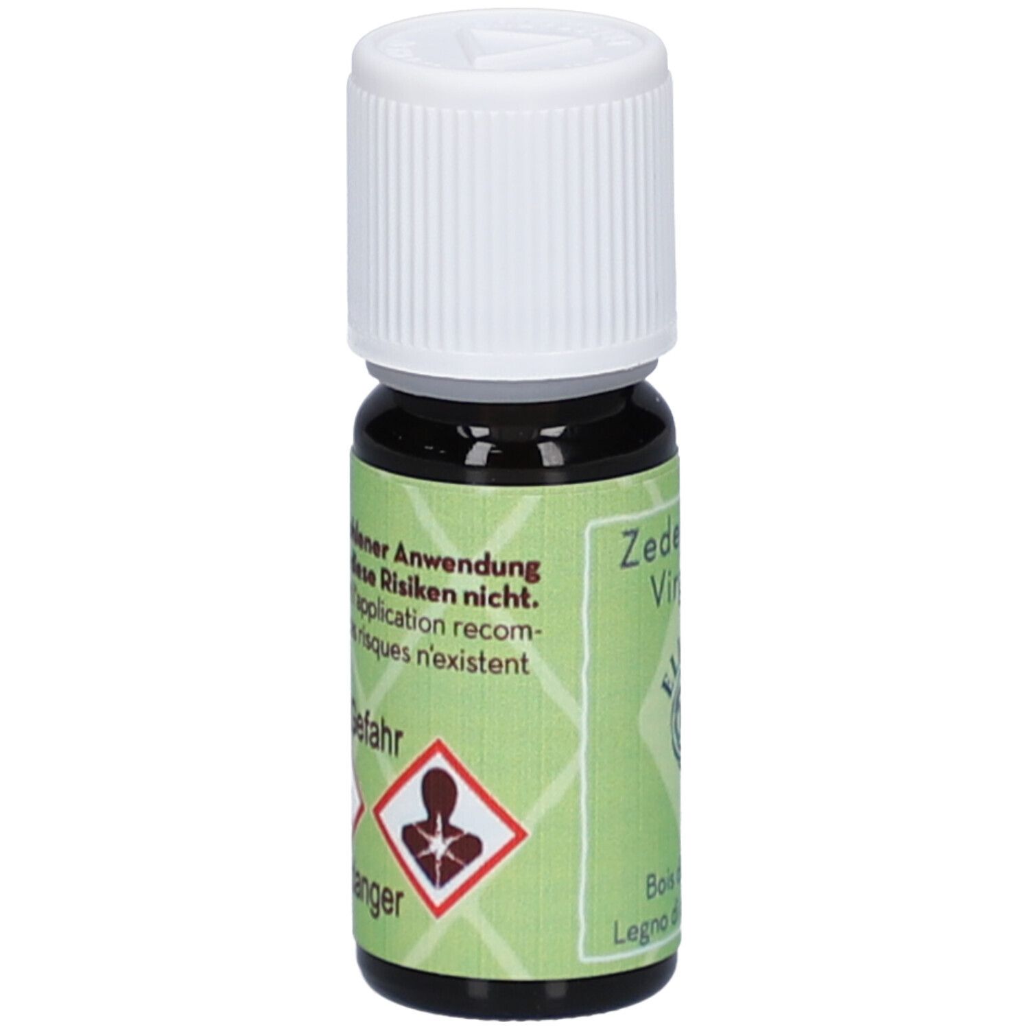 Kleine donkere glazen fles met witte schroefdop. Groene etiketten met waarschuwingssymbolen en tekst.