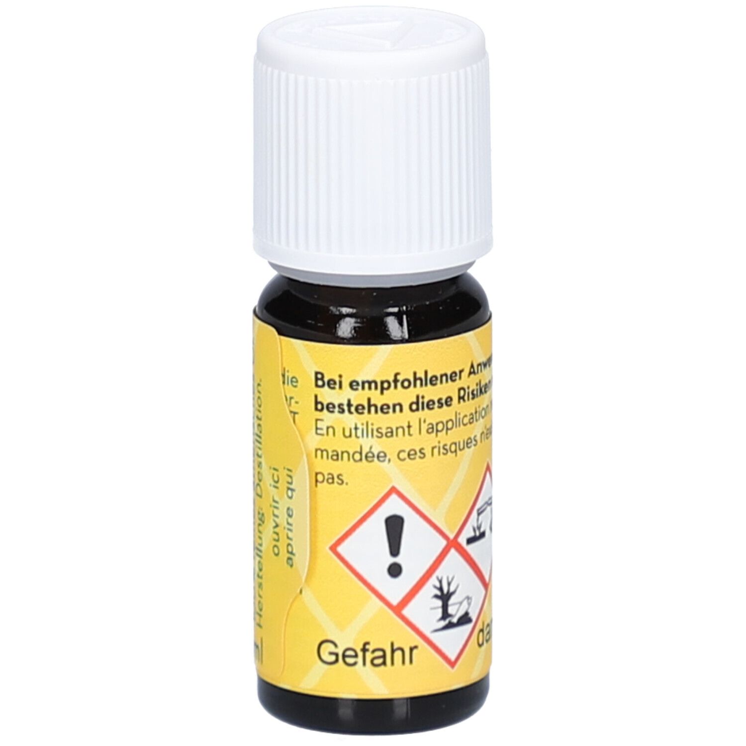 Bruine glazen fles met witte dop. Geel etiket met gevaarsymbolen en tekst: gevaar, Lemongrass Cochin.