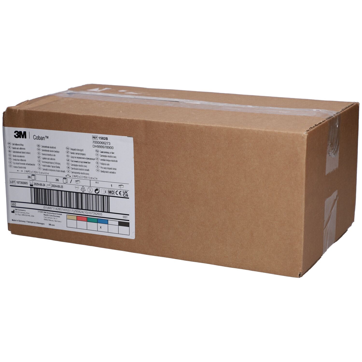 Emballage en carton brun avec étiquette 3M Coban. Autocollant avec informations sur le produit et code-barres.