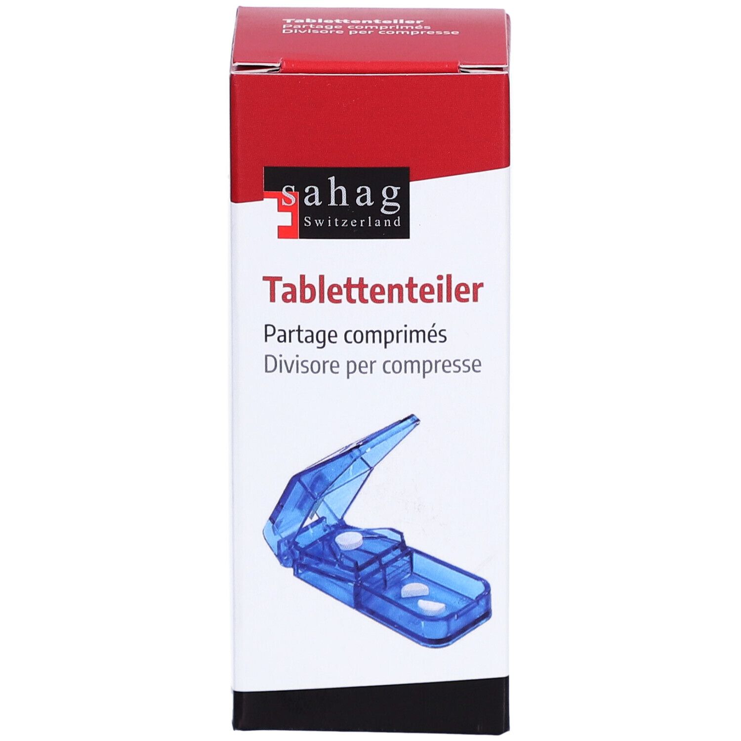 Diviseur de comprimés dans son emballage. Appareil bleu en plastique avec lame. Inscription: sahag Switzerland, diviseur de comprimés.