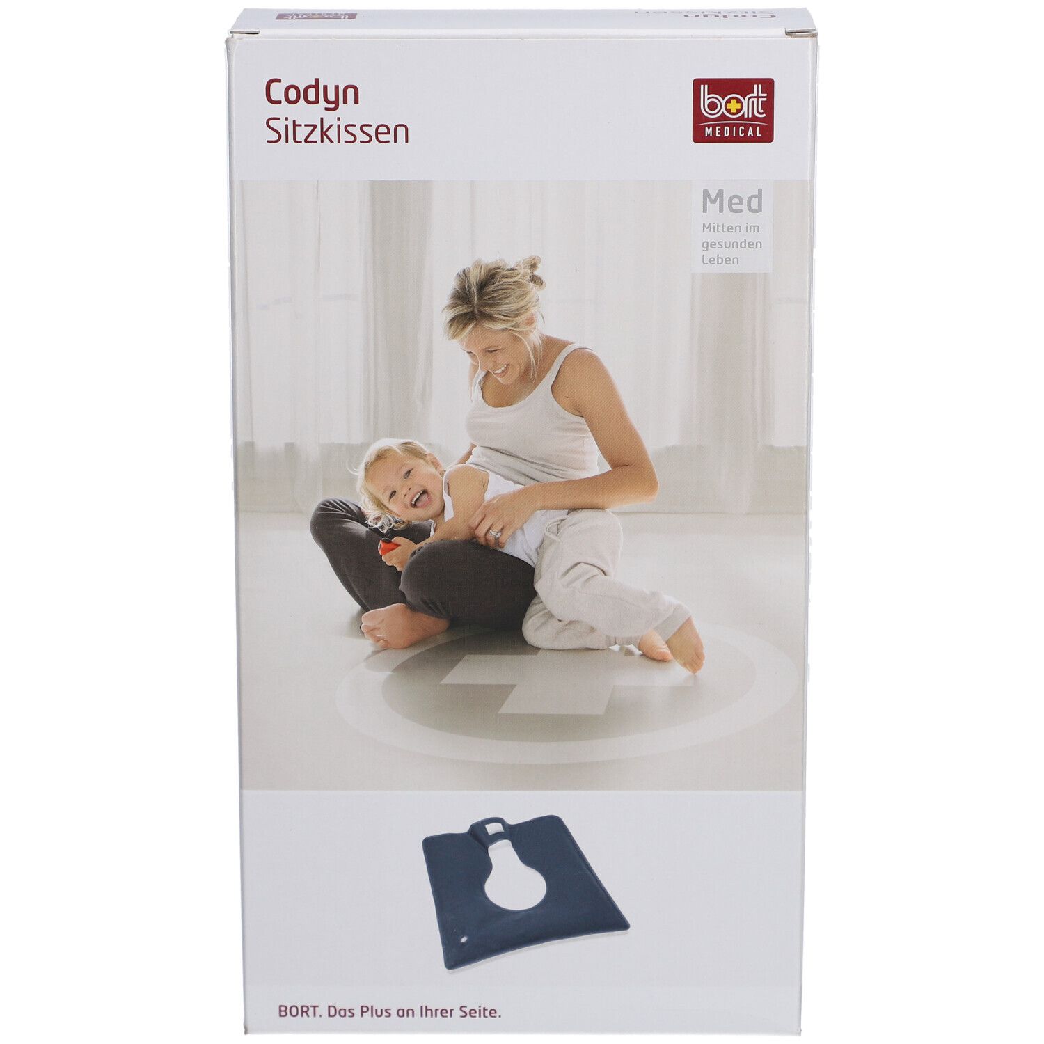 Emballage du coussin Codyn. Inscriptions : nom du produit, logo, image d'une femme avec un enfant. Coussin bleu au premier plan.