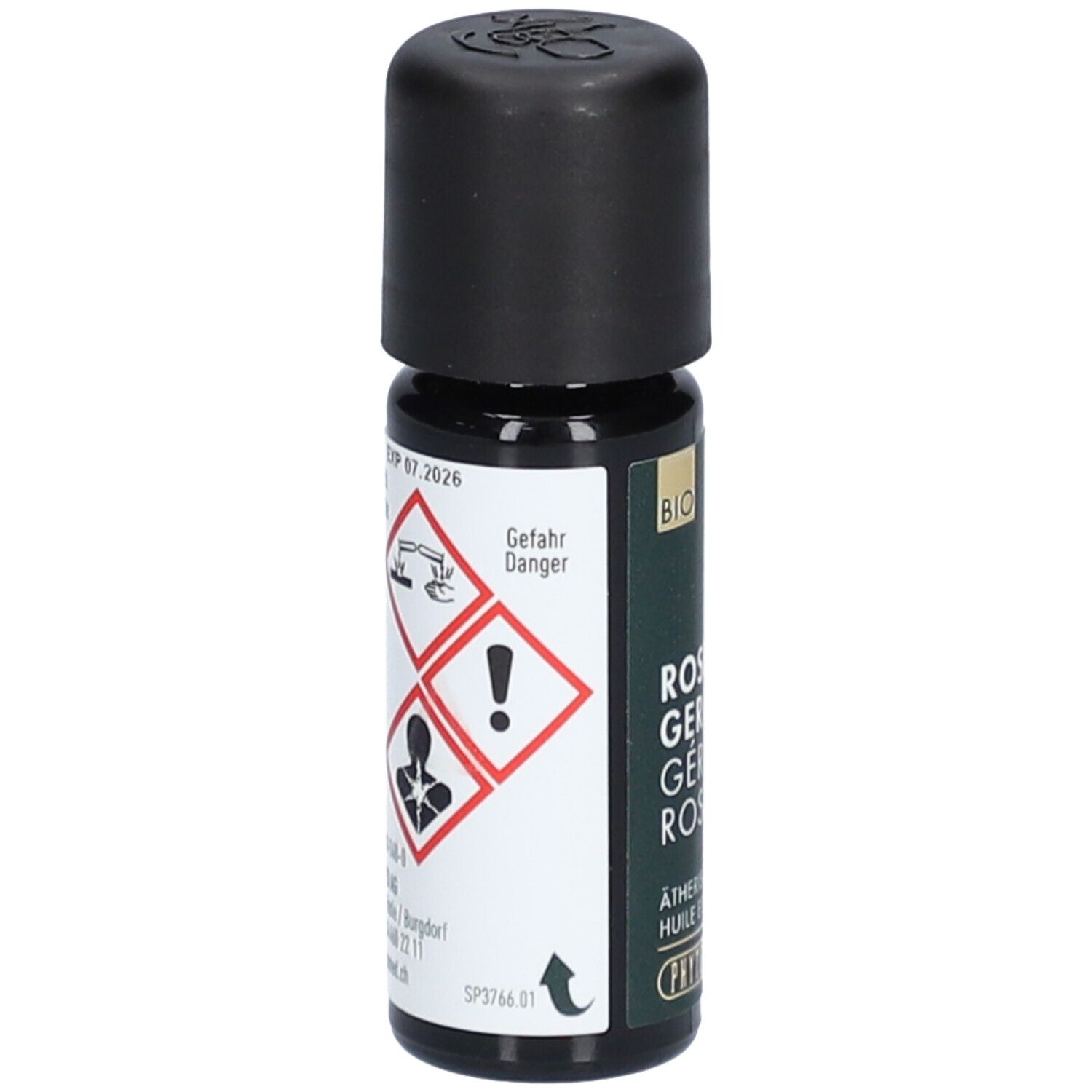 Bruine glazen fles met zwarte dop. Waarschuwingen en gevarensymbolen. Opschrift: Gefahr, Danger. Logo: Phytomed.