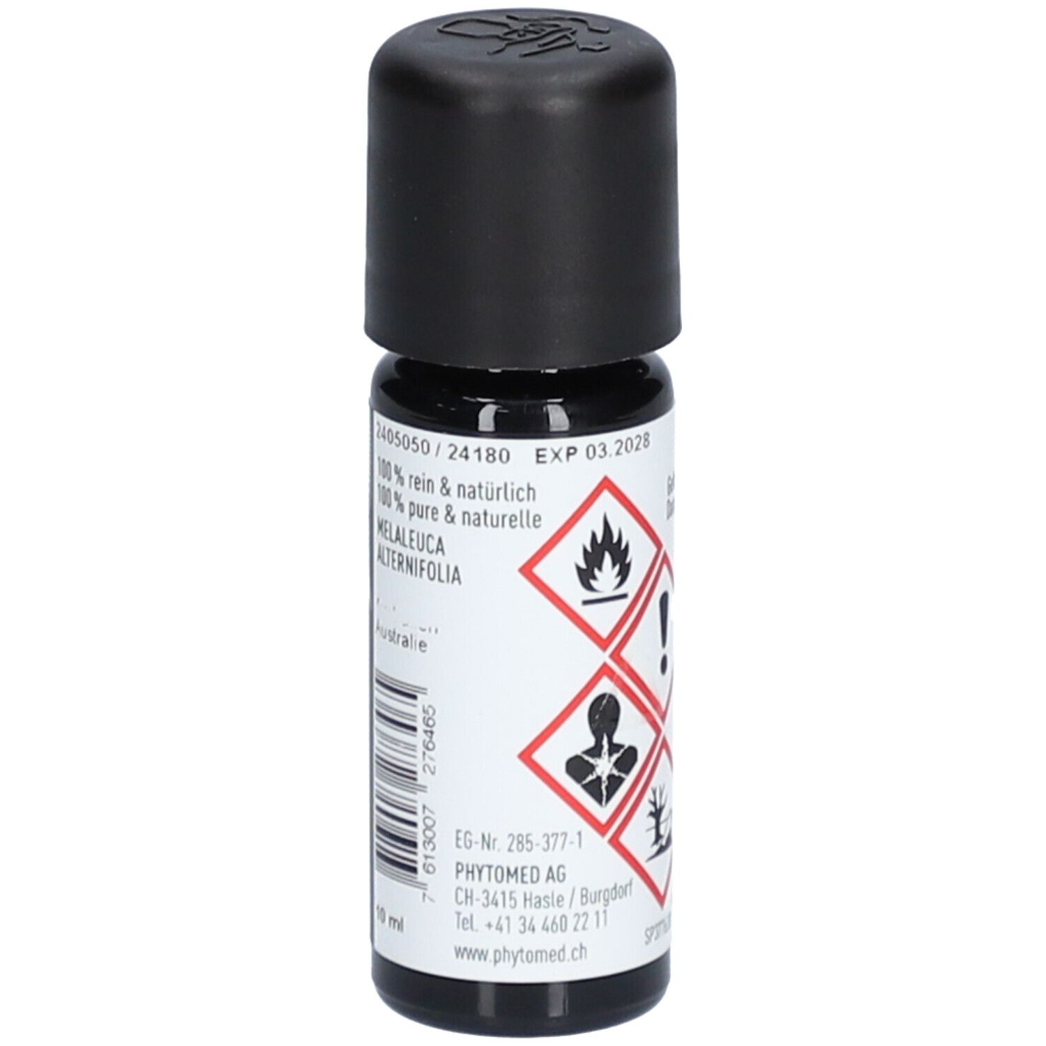 Bruine glazen fles met zwarte dop. Opschrift: 100% puur & natuurlijk, Melaleuca Alternifolia. EXP 03.2028. Merk: PHYTOMED.