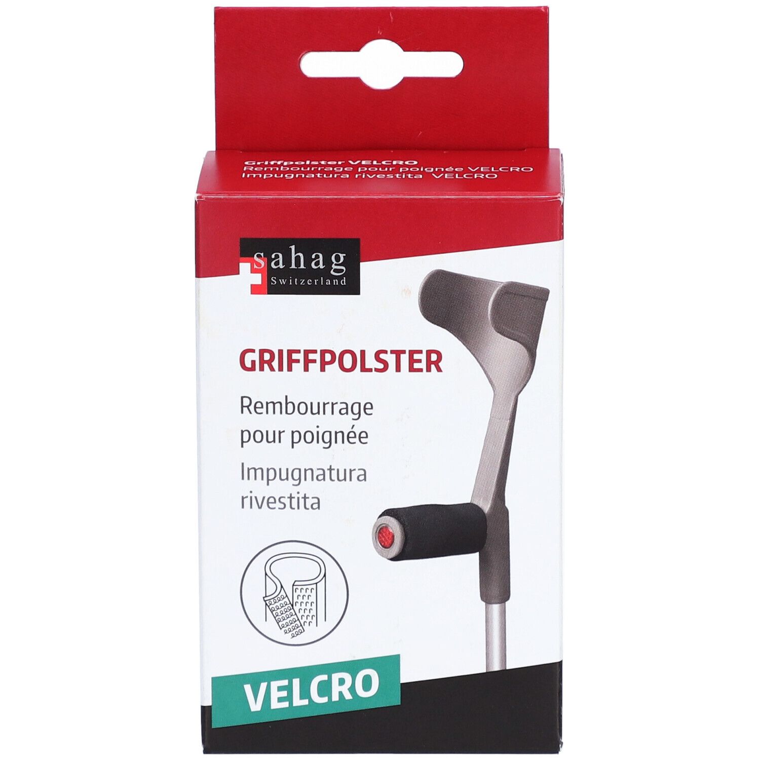 Verpakking met handgreepkussen. Merk: Sahag. Tekst: Griffpolster, Velcro. Illustratie van een krukhandvat. Rode en witte verpakking.