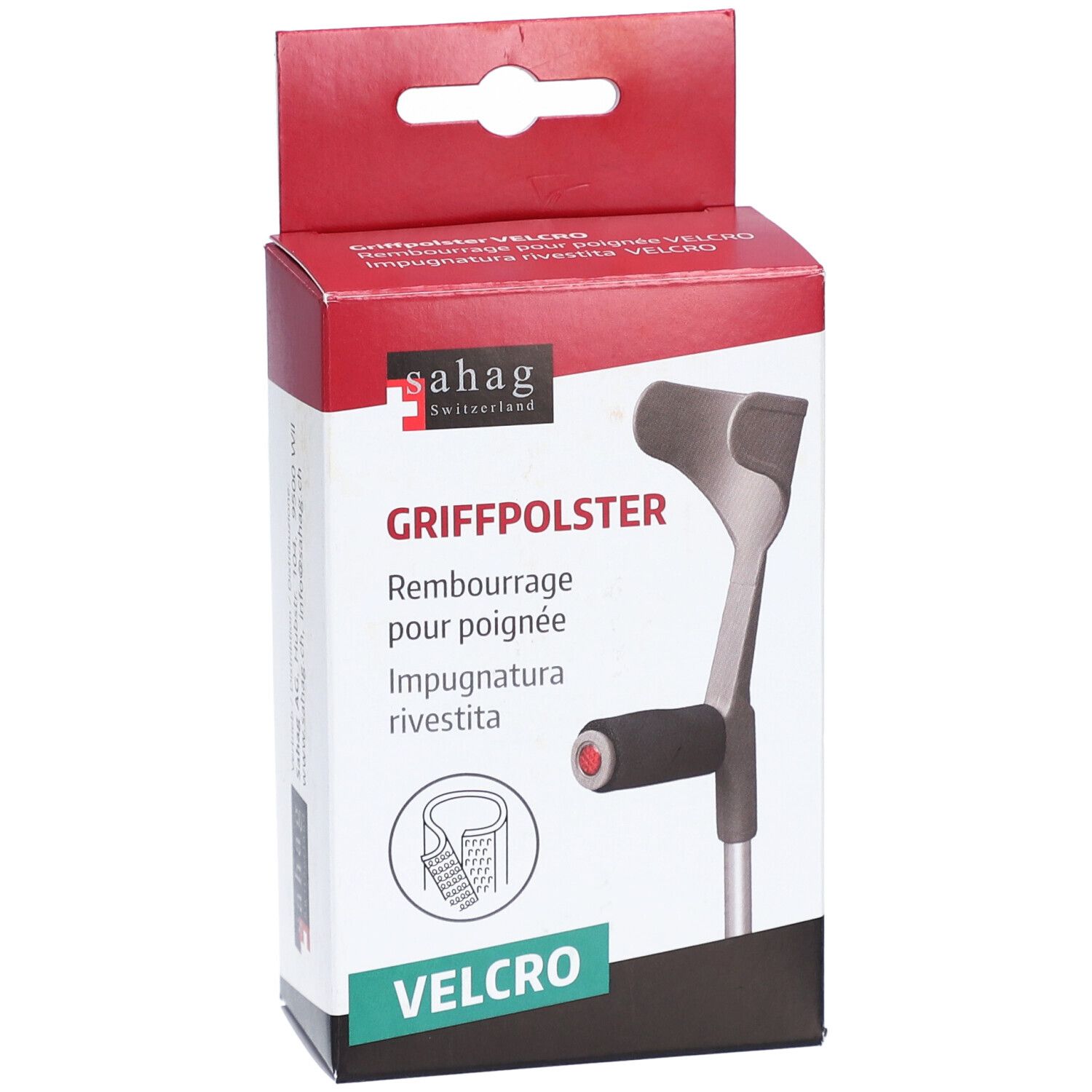 Verpakking met handgreepkussen. Merk: Sahag. Tekst: Griffpolster, Velcro. Illustratie van een krukhandvat. Rode en witte verpakking.