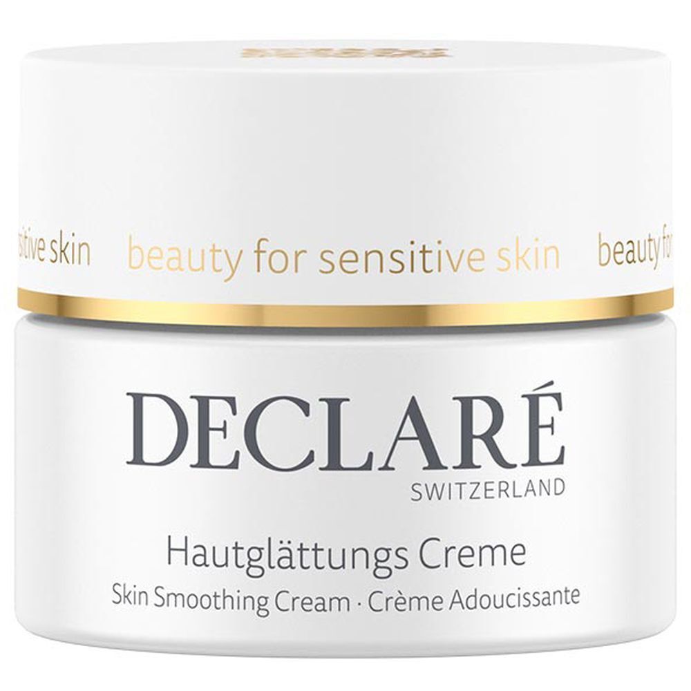 Witte crèmetiegel met gouden rand. Opschrift: DECLARÉ, Hautglättungs Creme. Tekst: Skin Smoothing Cream, Crème Adoucissante.