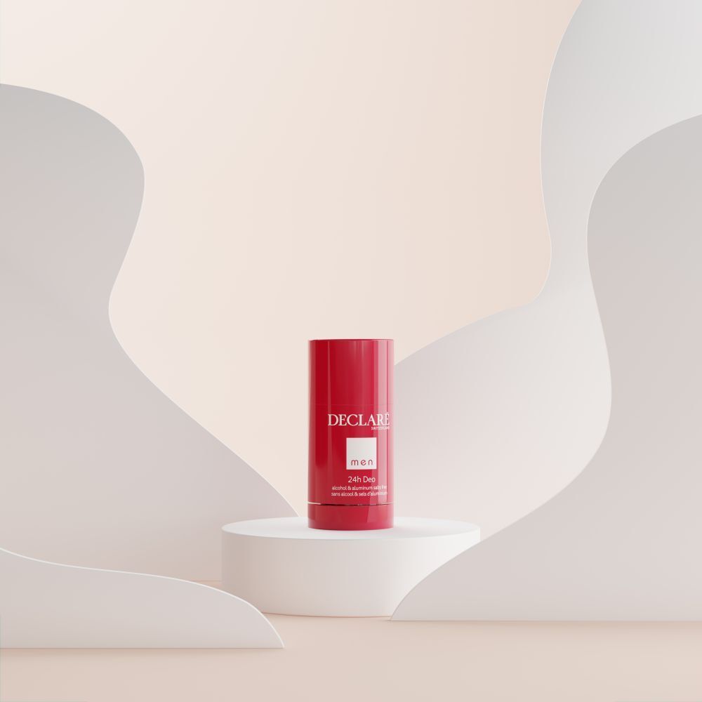 Déodorant rouge sur socle blanc. Fond avec formes blanches ondulées.