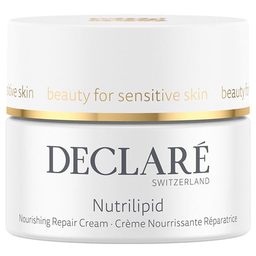 Witte pot met gouden deksel. Opschrift: DECLARÉ, Nutrilipid, Nourishing Repair Cream. Voor de gevoelige huid.