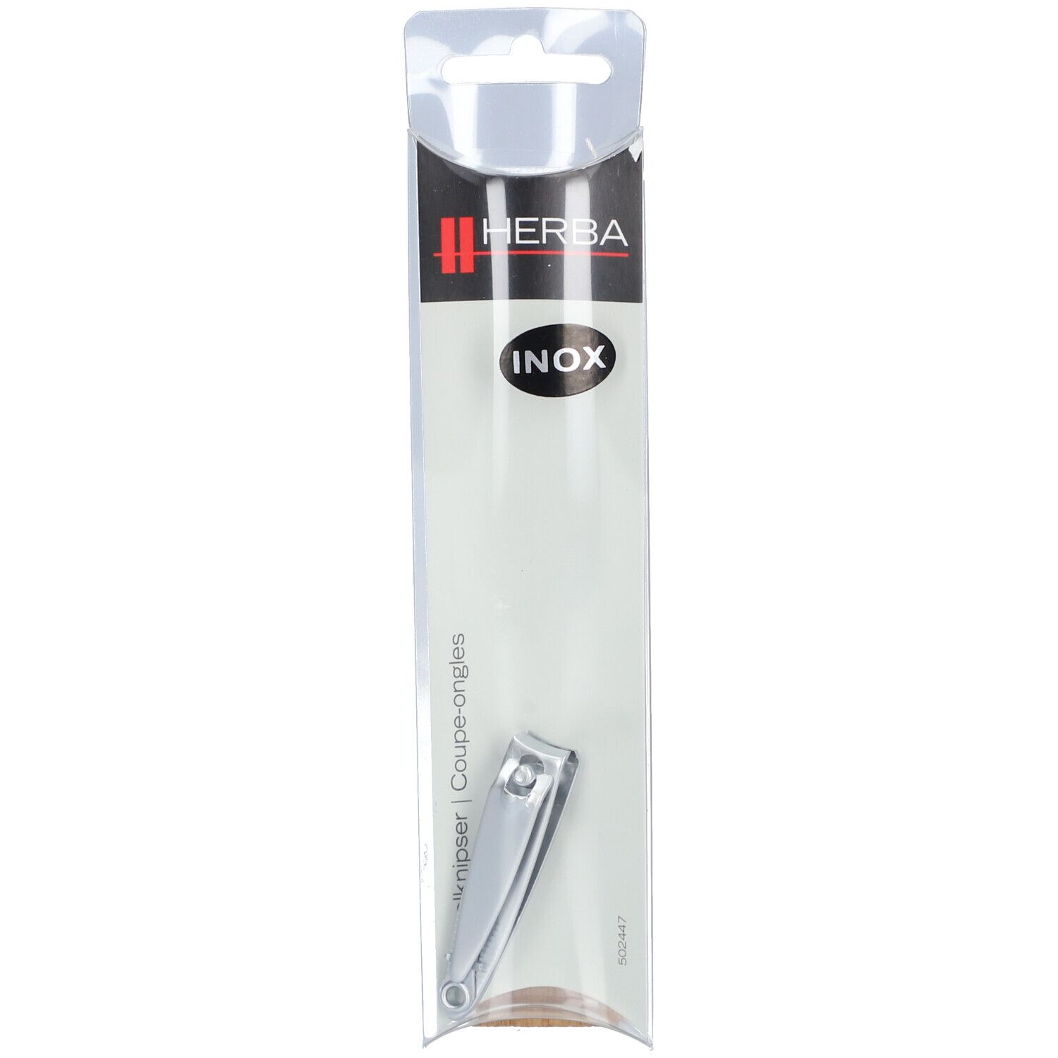 Coupe-ongles en emballage transparent. Marque HERBA, inscription INOX. Produit métallique visible.